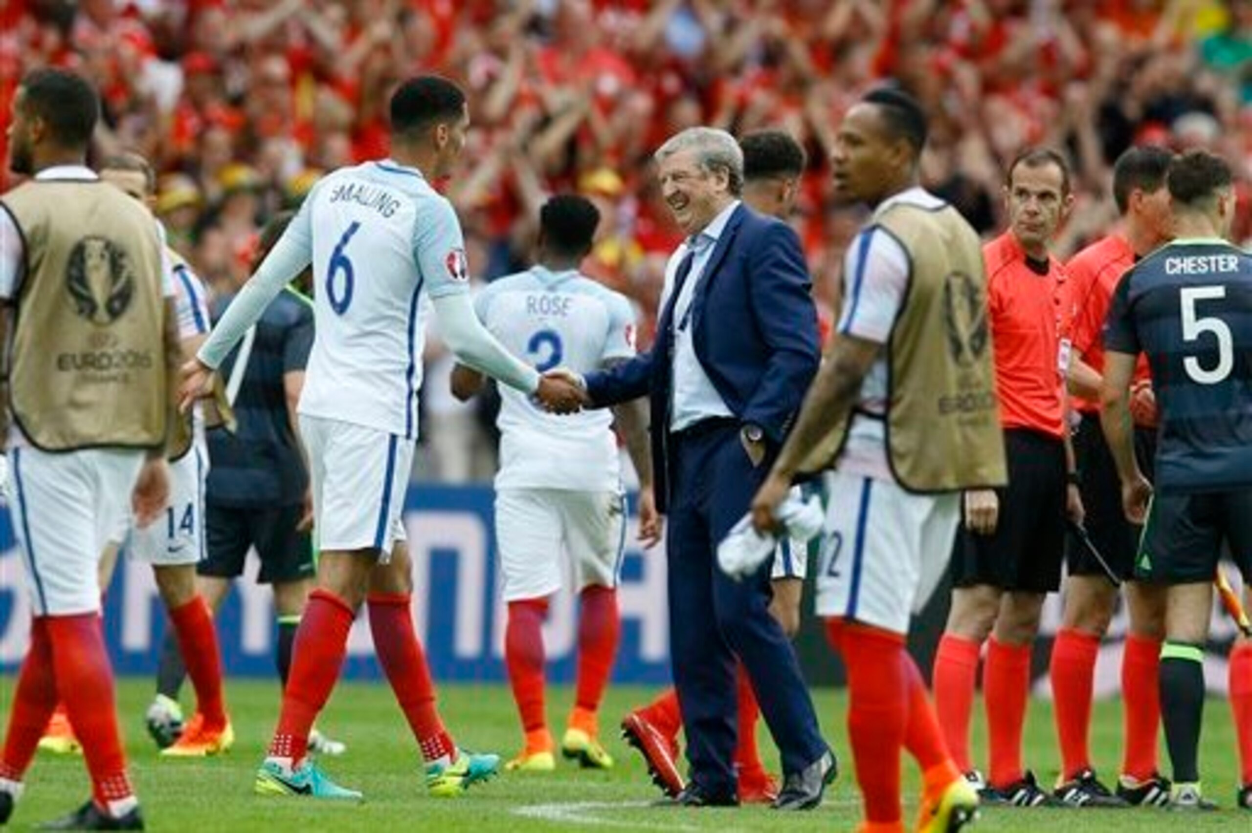 Hodgson celebrates with his players after their defeat of Wales. Both the result and his team's underwhelming performance has given him and his coaching staff plenty to think about.