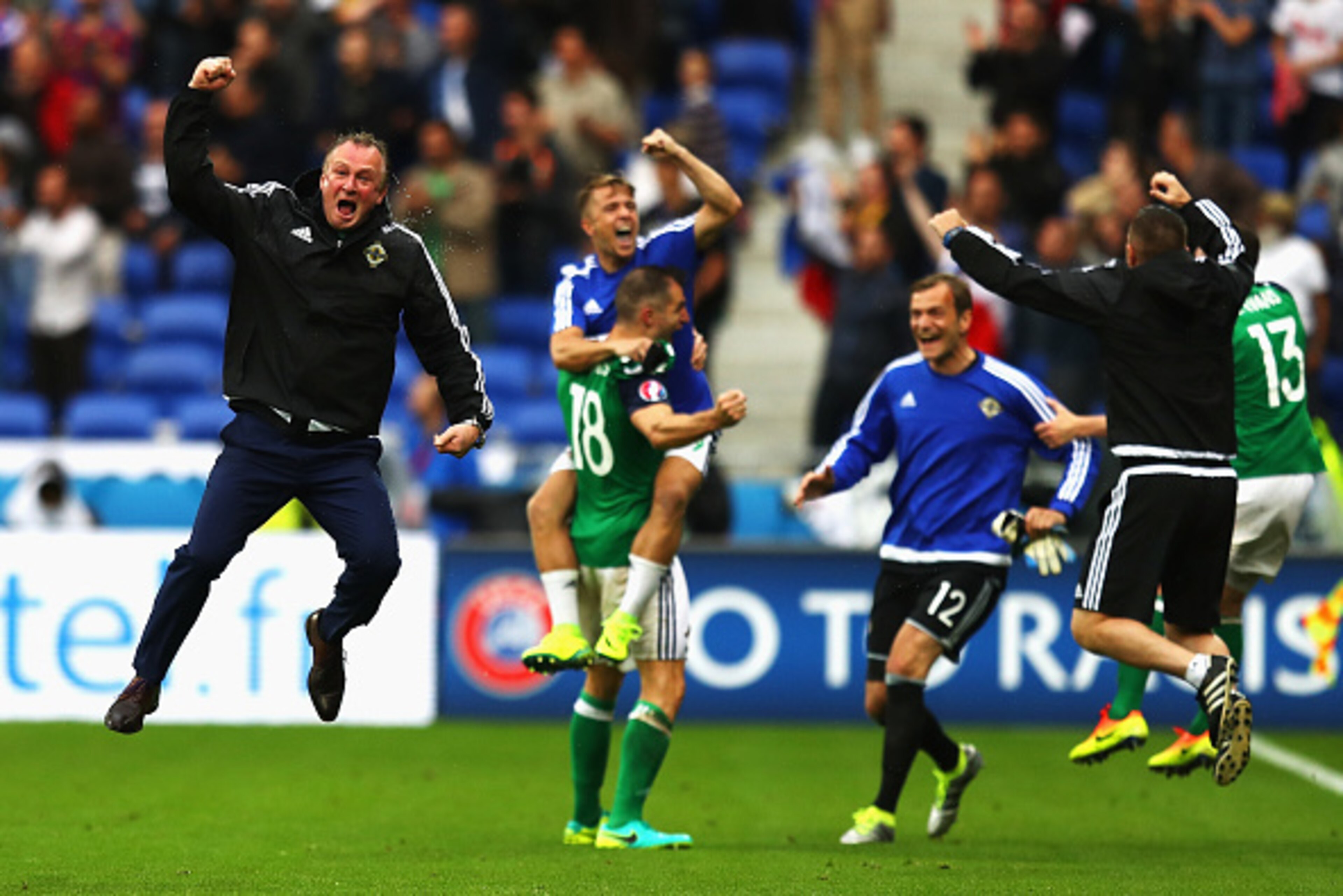 LYON, FRANCE - JUNE 16:  Michael O'Neill (L) manager of Northern Ireland celebrates his team's second goal during the UEFA EURO 2016 Group C match between Ukraine and Northern Ireland at Stade des Lumieres on June 16, 2016 in Lyon, France.  (Photo by Juli