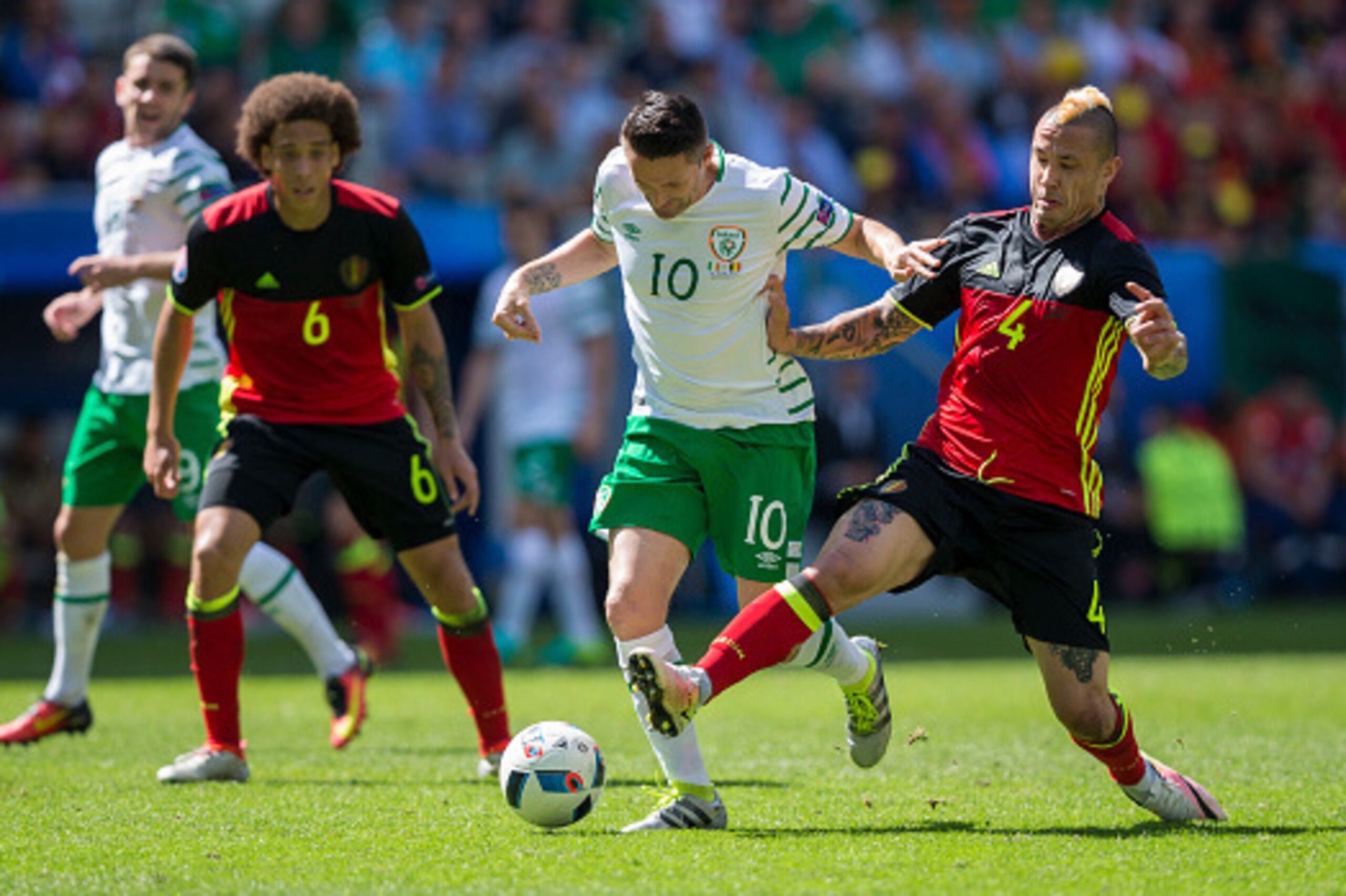 BORDEAUX, FRANCE - JUNE 18:  Republic of Ireland's Robbie Keane is tackled by Belgium's Radja Nainggolan during the UEFA Euro 2016 Group E match between Belgium and Republic of Ireland at Stade de Bordeaux on June 18, 2016 in Bordeaux, France.  (Photo by 