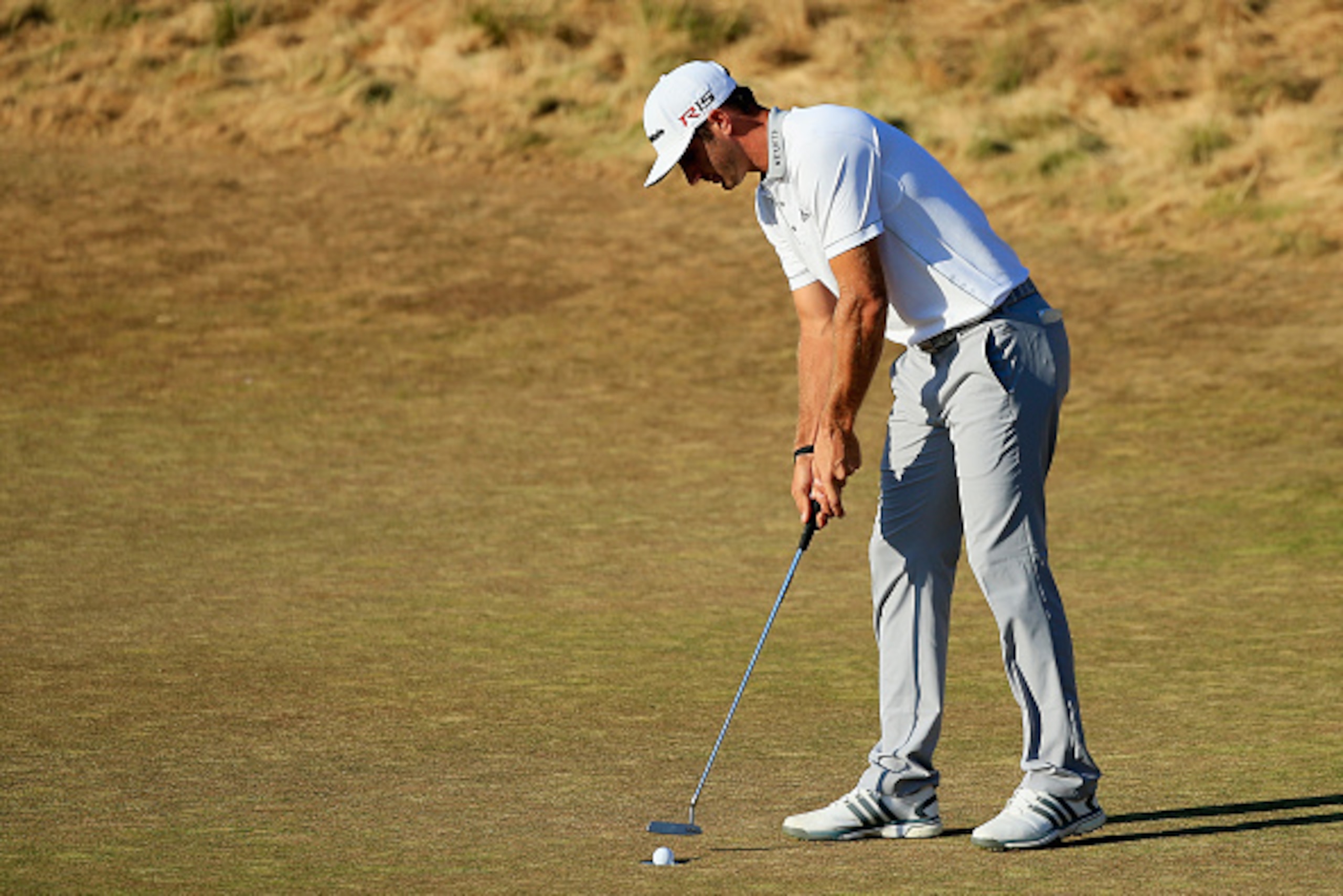 UNIVERSITY PLACE, WA - JUNE 21:  Dustin Johnson of the United States putts for par on the 18th green during the final round of the 115th U.S. Open Championship at Chambers Bay on June 21, 2015 in University Place, Washington.  (Photo by David Cannon/Getty