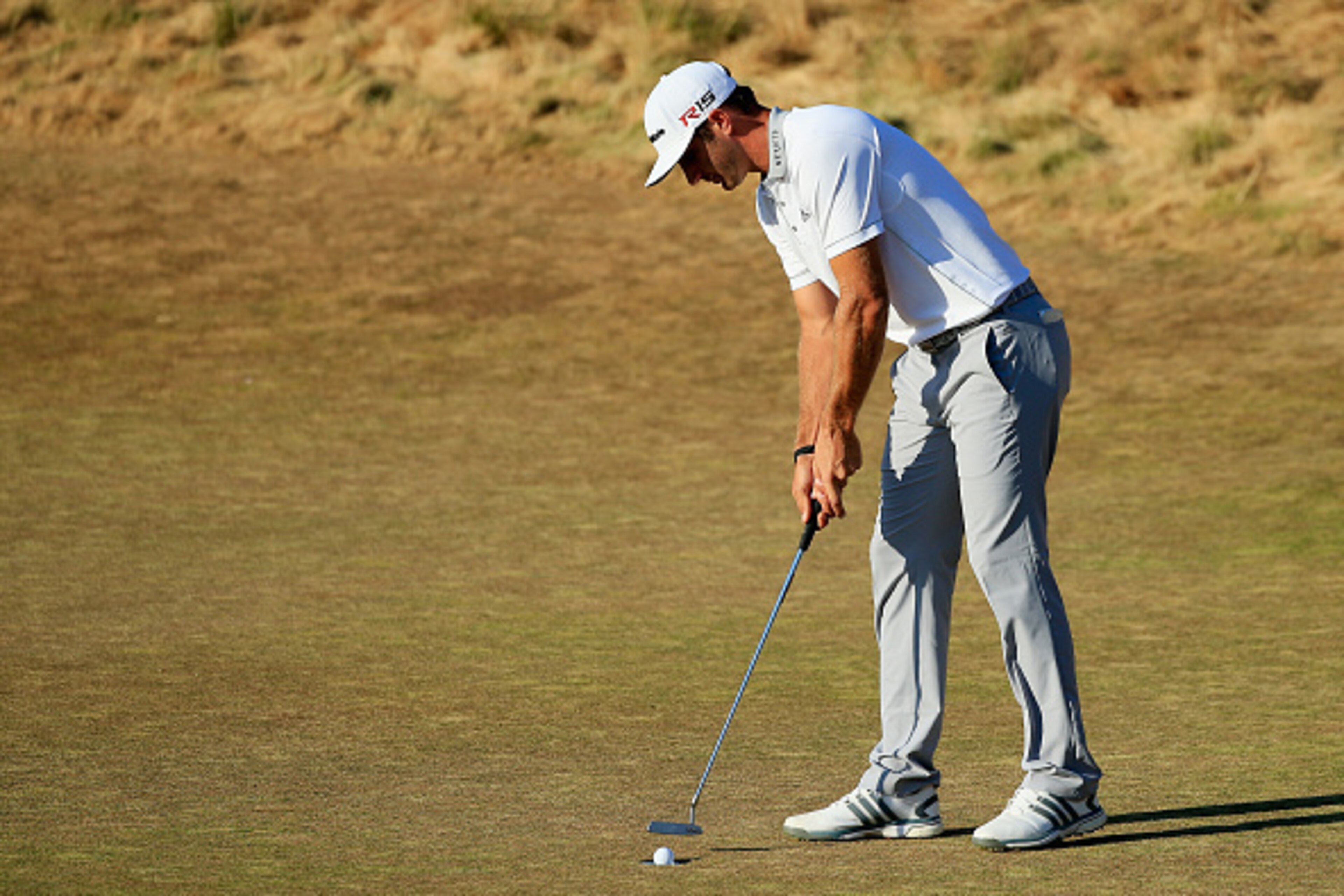 UNIVERSITY PLACE, WA - JUNE 21: Dustin Johnson of the United States putts for par on the 18th green during the final round of the 115th U.S. Open Championship at Chambers Bay on June 21, 2015 in University Place, Washington. (Photo by David Cannon/Getty UNIVERSITY PLACE, WA - JUNE 21: Dustin Johnson of the United States putts for par on the 18th green during the final round of the 115th U.S. Open Championship at Chambers Bay on June 21, 2015 in University Place, Washington. (Photo by David Cannon/Getty