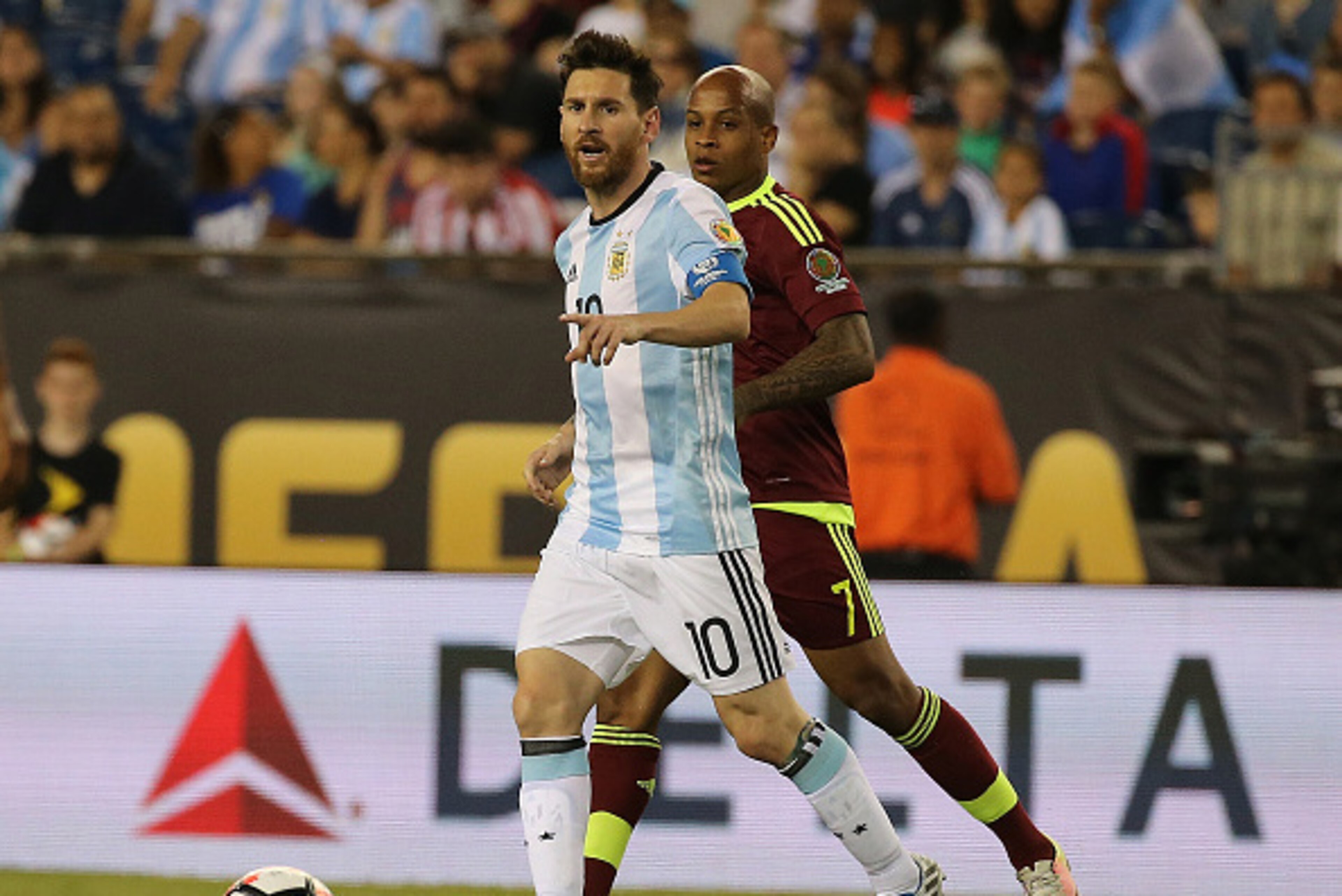 FOXBORO, MA - JUNE 18:  Lionel Messi #10 of Argentina keeps the ball from Yonathan Del Valle of Venezuela during the 2016 Copa America Centenario quarterfinal match against Venezuela at Gillette Stadium on June 18, 2016 in Foxboro, Massachusetts. (Photo b