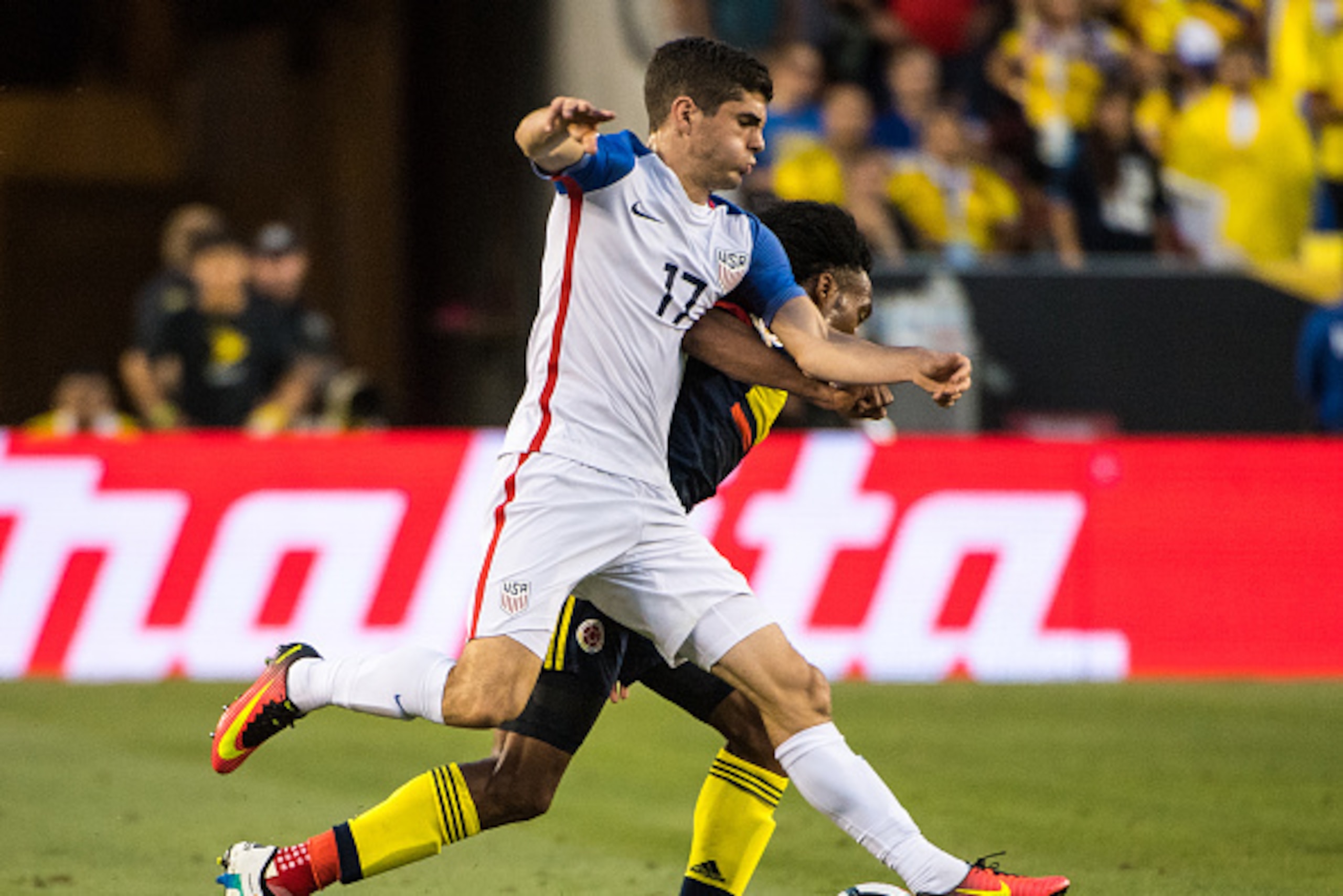 SANTA CLARA, CA - JUNE 3: Juan Cuadrado #11 of Colombia battles Christian Pulisic #17 of United States  during the Copa America Centenario Group A match between the United States and Columbia at Levi's Stadium on June 3, 2016 in Santa Clara, California.  
