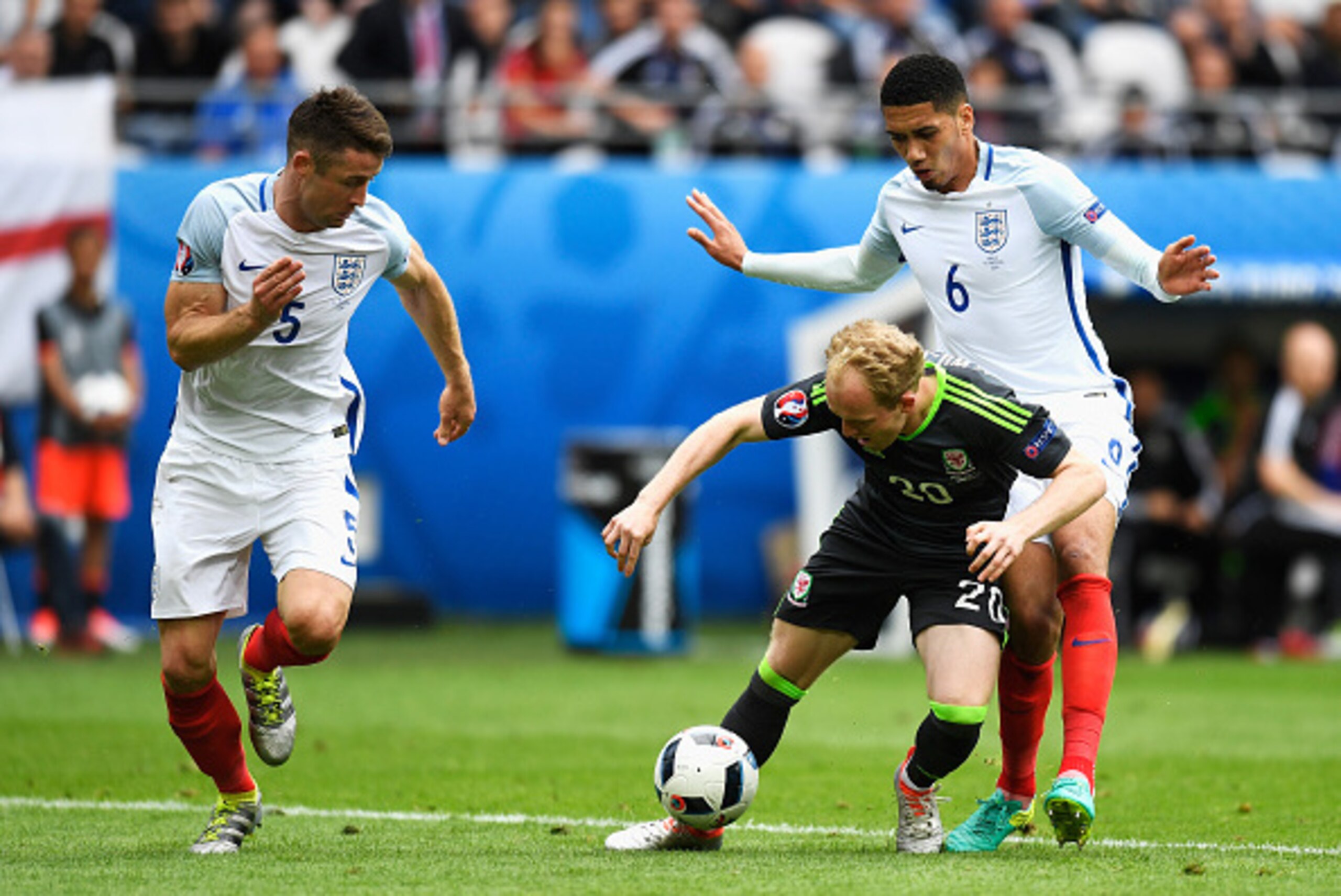 LENS, FRANCE - JUNE 16:  Jonathan Williams of Wales goes down under pressure from Chris Smalling and Gary Cahill of England during the UEFA EURO 2016 Group B match between England and Wales at Stade Bollaert-Delelis on June 16, 2016 in Lens, France.  (Pho