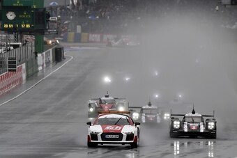 Switzerland's Neel Jani drives his Porsche 919 Hybrid N°2, ahead of Germanys Timo Bernhard in his Porsche 919 Hybrid N°1 and Switzerland's Sebastien Buemi in his Toyota TSO50 Hybrid N°5, as they take the start of the 84th Le Mans 24-hours endurance race, 