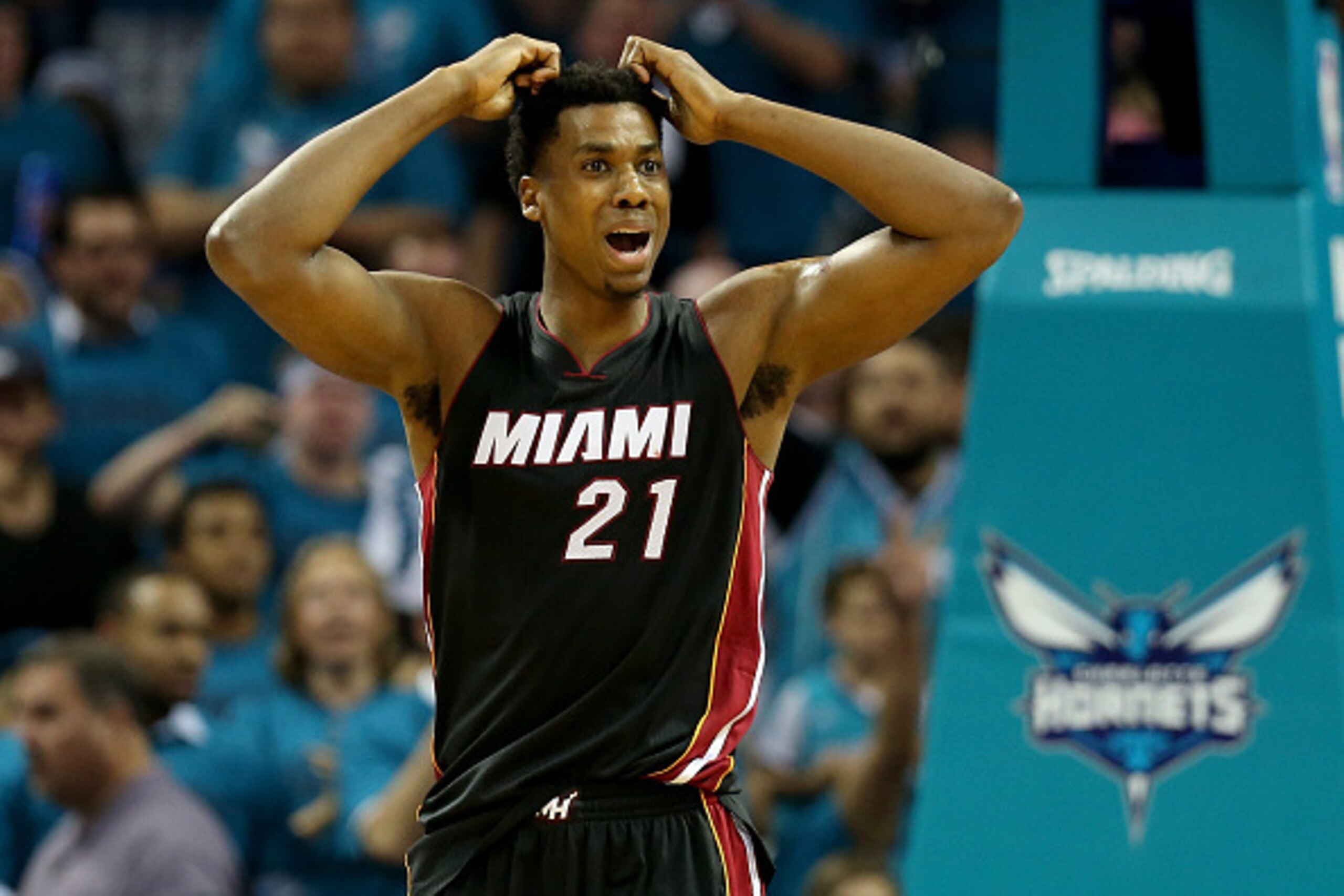 CHARLOTTE, NC - APRIL 29:  Hassan Whiteside #21 of the Miami Heat reacts after a call against the Charlotte Hornets during game six of the Eastern Conference Quarterfinals of the 2016 NBA Playoffs at Time Warner Cable Arena on April 29, 2016 in Charlotte,