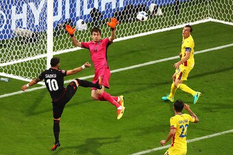LYON, FRANCE - JUNE 19:  Armando Sadiku (1st L) of Albania heads the ball to score the opening goal past Ciprian Tatarusanu (2nd L) of Romania during the UEFA EURO 2016 Group A match between Romania and Albania at Stade des Lumieres on June 19, 2016 in Ly