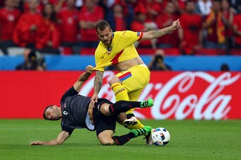 LYON, FRANCE - JUNE 19: Ledian Memushaj of Albania and Denis Alibec of Romania during the UEFA EURO 2016 Group A match between Romania and Albania at Stade des Lumieres on June 19, 2016 in Lyon, France. (Photo by Catherine Ivill - AMA/Getty Images)