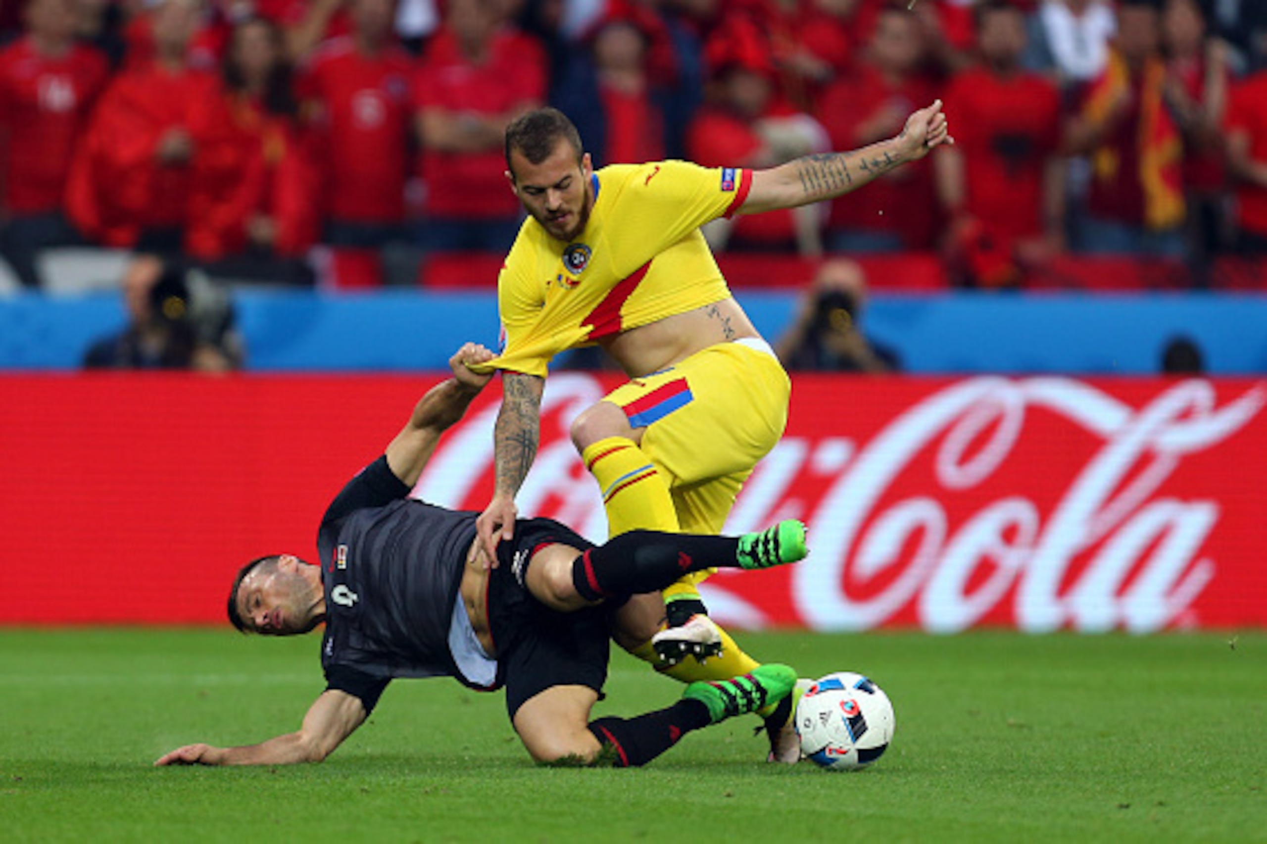 LYON, FRANCE - JUNE 19: Ledian Memushaj of Albania and Denis Alibec of Romania during the UEFA EURO 2016 Group A match between Romania and Albania at Stade des Lumieres on June 19, 2016 in Lyon, France. (Photo by Catherine Ivill - AMA/Getty Images)