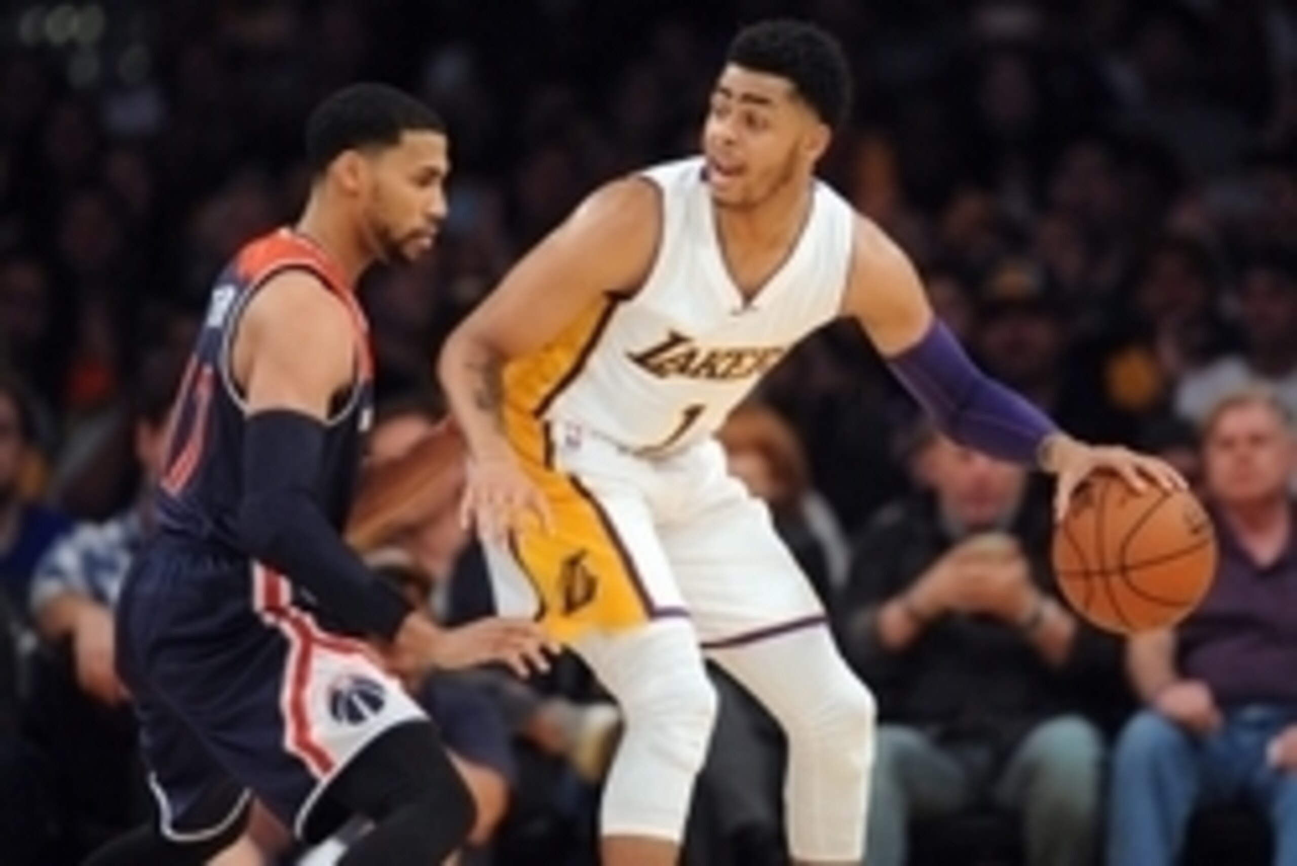 March 27, 2016; Los Angeles, CA, USA; Los Angeles Lakers guard D'Angelo Russell (1) moves the ball against Washington Wizards guard Garrett Temple (17) during the first half at Staples Center. Mandatory Credit: Gary A. Vasquez-USA TODAY Sports
