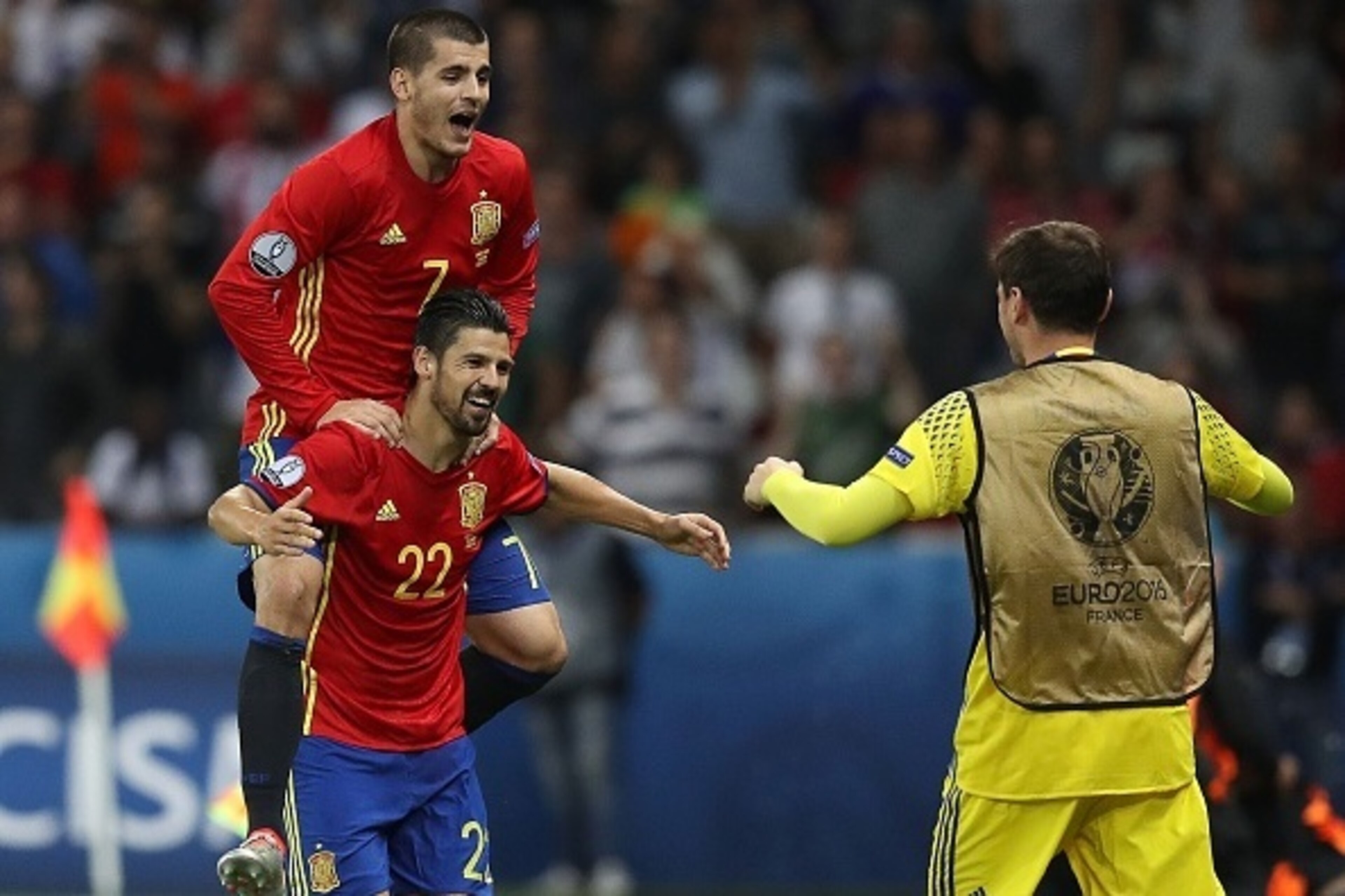 Spain's forward Nolito (L, bottom) celebrates his goal with Spain's forward Alvaro Morata (top) and Spain's goalkeeper Iker Casillas during the Euro 2016 group D football match between Spain and Turkey at the Allianz Riviera stadium in Nice on June 17, 20
