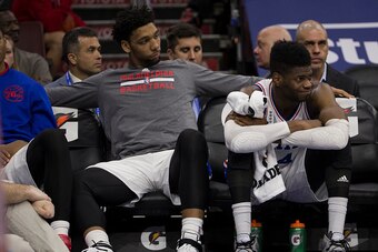 PHILADELPHIA, PA - FEBRUARY 23: Jahlil Okafor #8 and Nerlens Noel #4 of the Philadelphia 76ers watch the game against the Orlando Magic from the bench on February 23, 2016 at the Wells Fargo Center in Philadelphia, Pennsylvania. The Magic defeated the 76e
