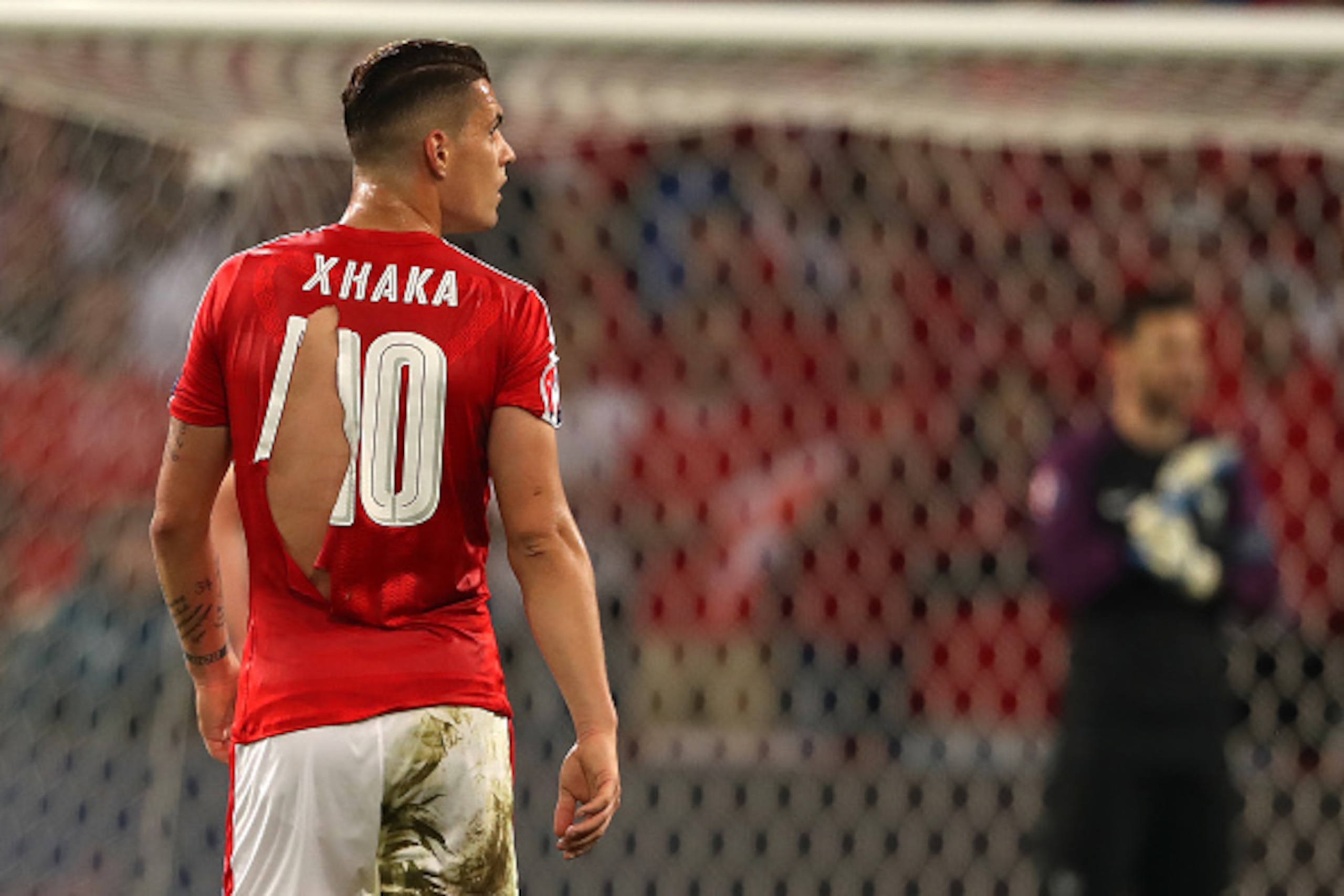 LILLE, FRANCE - JUNE 19: Granit Xhaka of Switzerland's ripped shirt during the UEFA EURO 2016 Group A match between Switzerland and France at Stade Pierre-Mauroy on June 19, 2016 in Lille, France. (Photo by Matthew Ashton - AMA/Getty Images) LILLE, FRANCE - JUNE 19: Granit Xhaka of Switzerland's ripped shirt during the UEFA EURO 2016 Group A match between Switzerland and France at Stade Pierre-Mauroy on June 19, 2016 in Lille, France. (Photo by Matthew Ashton - AMA/Getty Images)