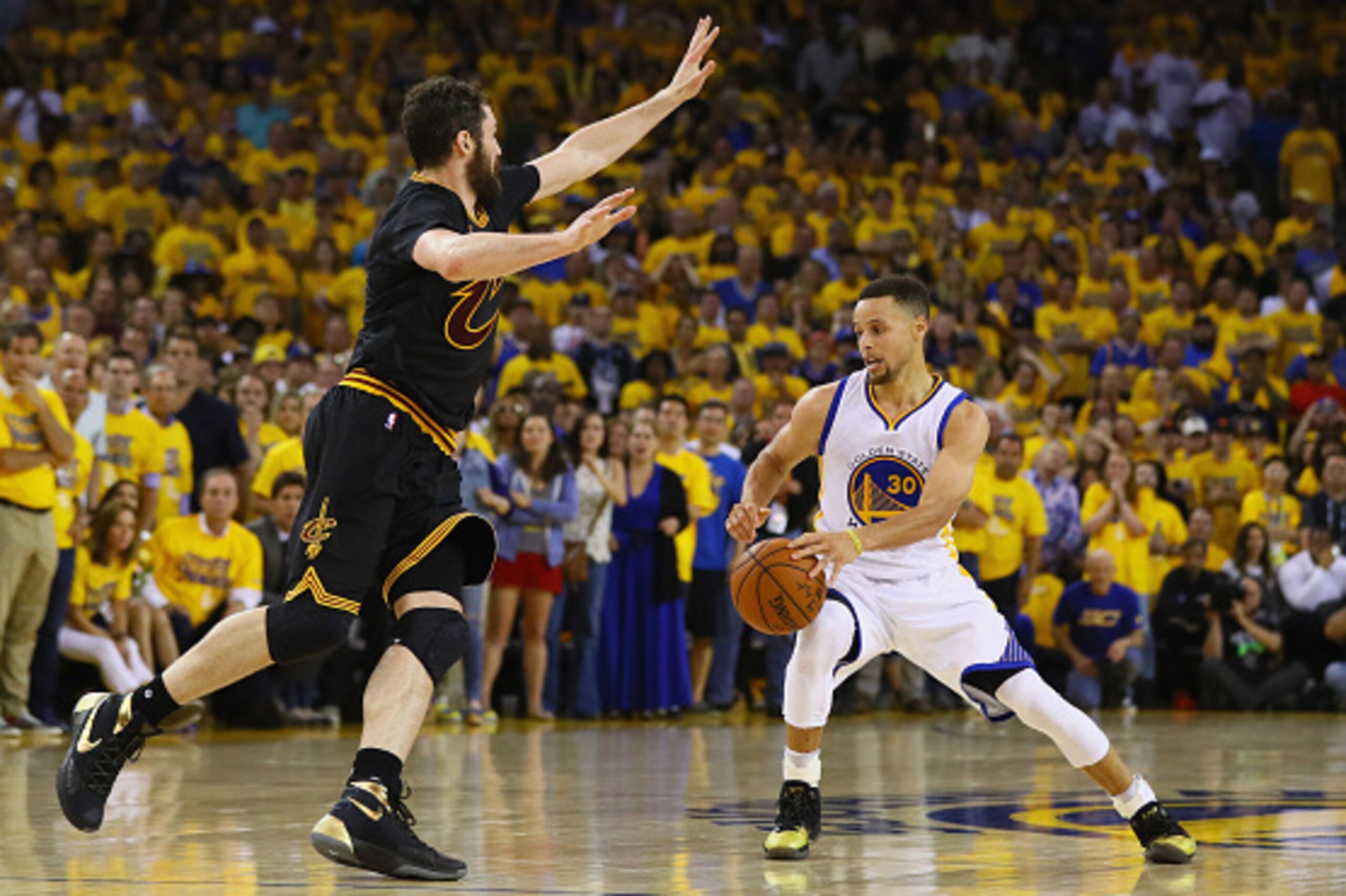 OAKLAND, CA - JUNE 19:  Stephen Curry #30 of the Golden State Warriors handles the ball against Kevin Love #0 of the Cleveland Cavaliers during the second half in Game 7 of the 2016 NBA Finals at ORACLE Arena on June 19, 2016 in Oakland, California. NOTE 