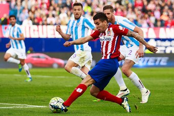 MADRID, SPAIN - APRIL 23: Angel Martin Correa of Atletico de Madrid strikes the ball during the La Liga match between Club Atletico de Madrid and Malaga CF at Vicente Calderon Stadium on April 23, 2016 in Madrid, Spain.  (Photo by Gonzalo Arroyo Moreno/Ge