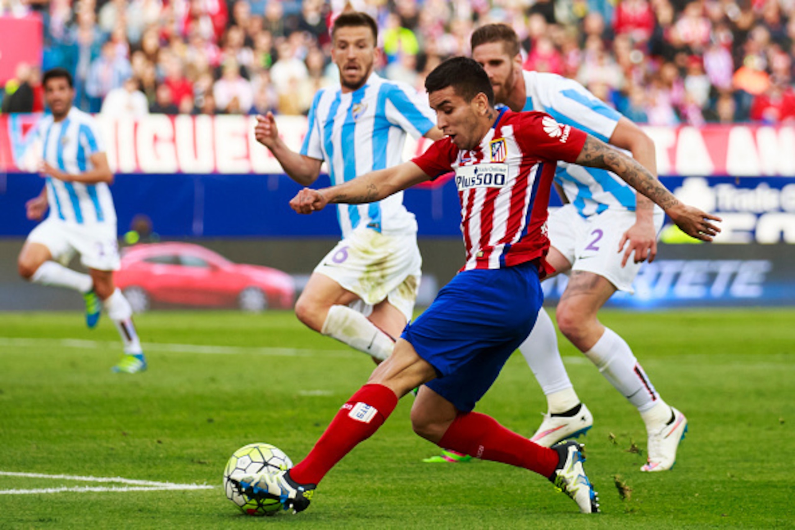 MADRID, SPAIN - APRIL 23: Angel Martin Correa of Atletico de Madrid strikes the ball during the La Liga match between Club Atletico de Madrid and Malaga CF at Vicente Calderon Stadium on April 23, 2016 in Madrid, Spain.  (Photo by Gonzalo Arroyo Moreno/Ge