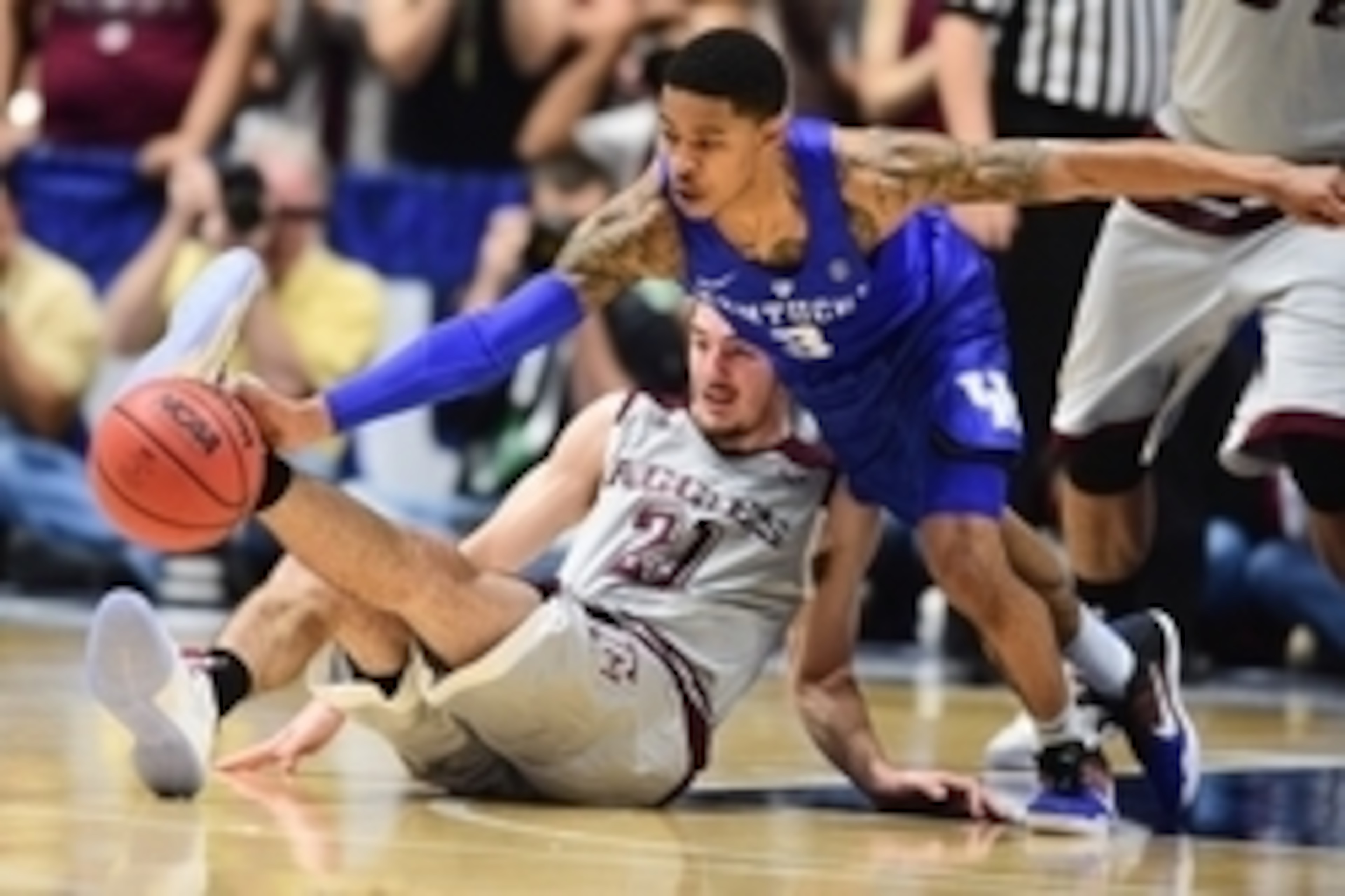 Mar 13, 2016; Nashville, TN, USA; Texas A&M Aggies guard Alex Caruso (21) and Kentucky Wildcats guard Tyler Ulis (3) fight for possession of the ball during second half of the championship game of the SEC tournament at Bridgestone Arena. Mandatory Credit: