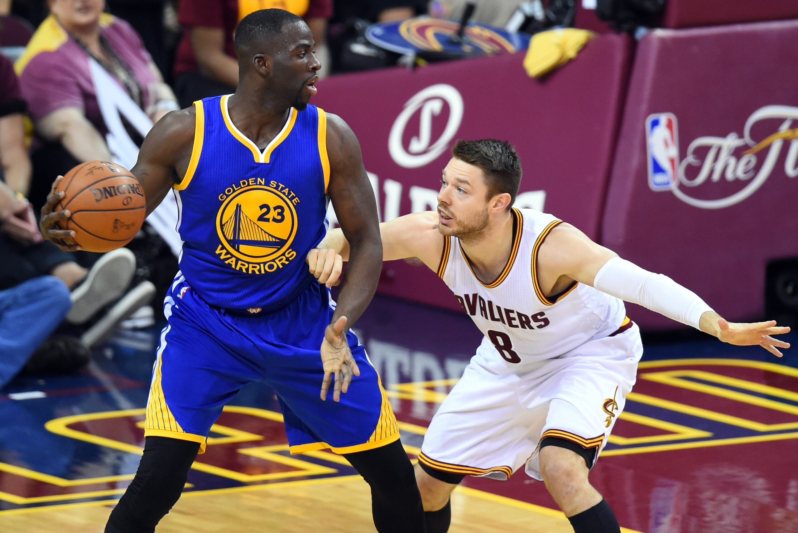 Jun 10, 2016; Cleveland, OH, USA; Golden State Warriors forward Draymond Green (23) handles the ball against Cleveland Cavaliers guard Matthew Dellavedova (8) during the second quarter in game four of the NBA Finals at Quicken Loans Arena. Mandatory Credi