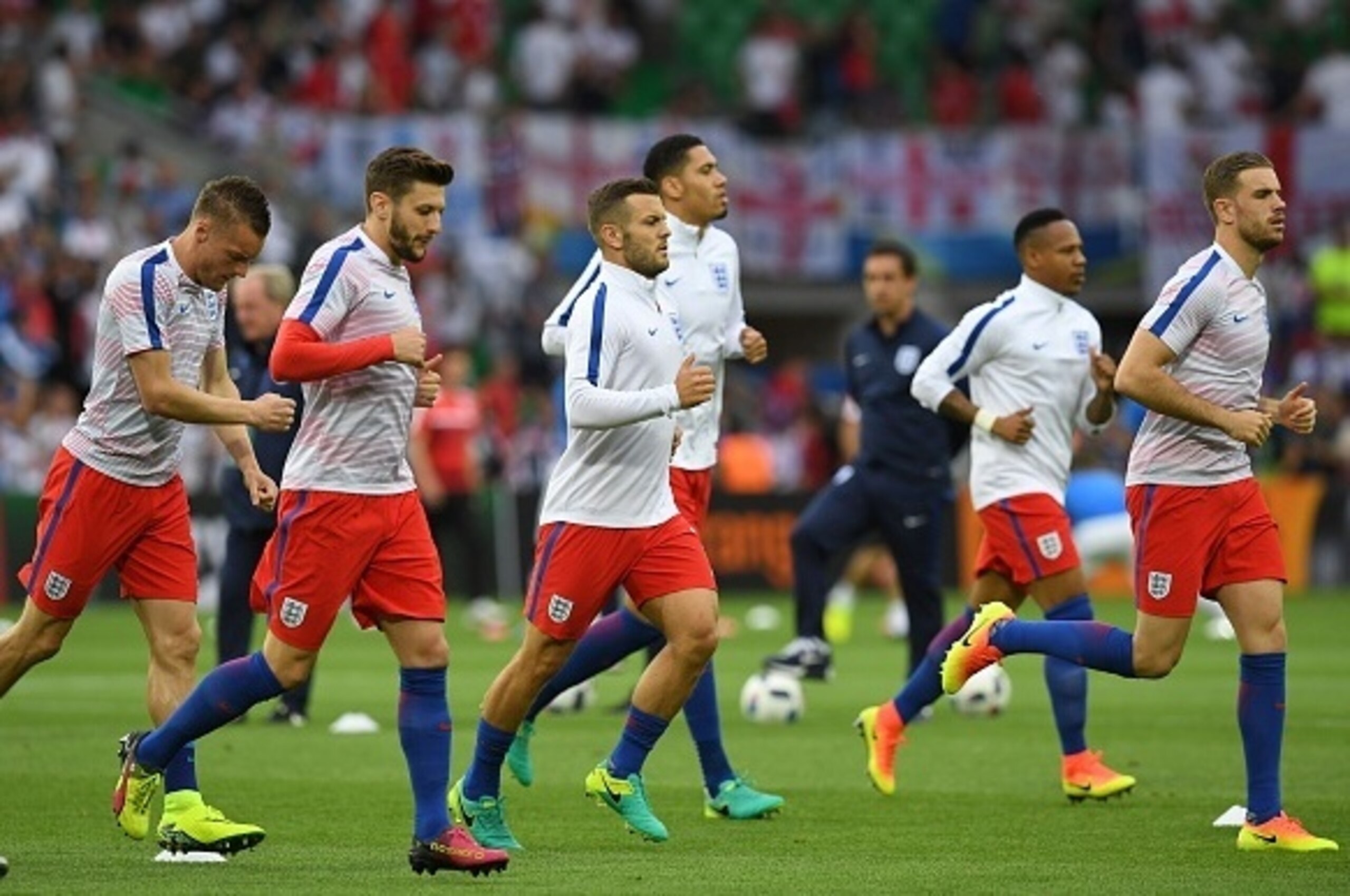 (L to R) England's forward Jamie Vardy, England's midfielder Adam Lallana, England's midfielder Jack Wilshere, England's defender Chris Smalling, England's defender Nathaniel Clyne and England's midfielder Jordan Henderson warm-up ahead of the Euro 2016 g