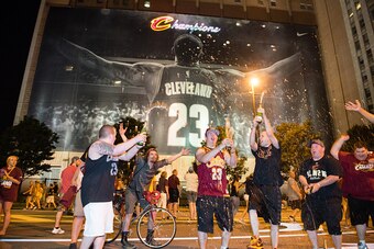 CLEVELAND, OH -  JUNE 19: Fans react in downtown Cleveland after the Cleveland Cavaliers won  the NBA Championship on June 19, 2016 in Cleveland, Ohio. (Photo by Jason Miller/Getty Images)