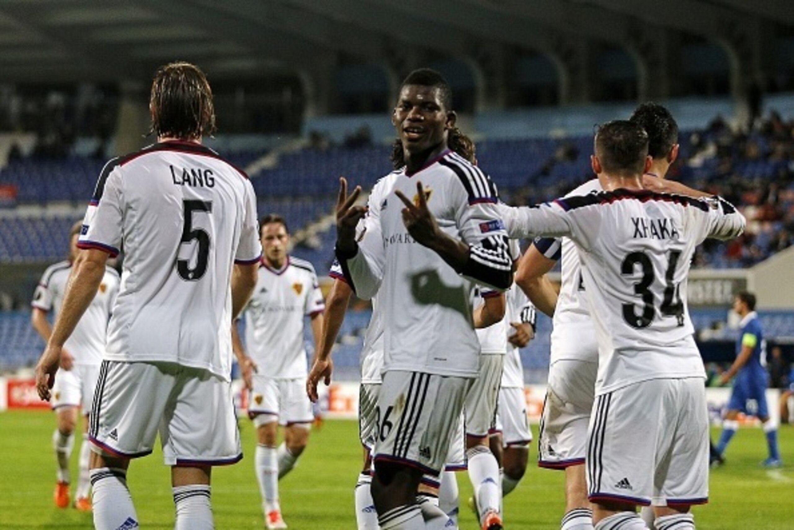 Basel's forward Breel Embolo (C) celebrates his goal during the UEFA Europa League group I football match CF Os Belenenses vs FC Basel at the Restelo stadium in Lisbon on November 5, 2015.   AFP PHOTO/ JOSE MANUEL RIBEIRO        (Photo credit should read 