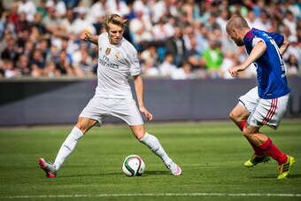 OSLO, NORWAY - August 9: Martin Odegaard  of Real Madrid, Christian Grindheim of Vaalerenga  during  Pre-season Friendly  match between Vaalerenga and Real Madrid at Ullevaal Stadion on August  9, 2015 in Oslo, Norway.  (Photo by Trond Tandberg/Getty Imag
