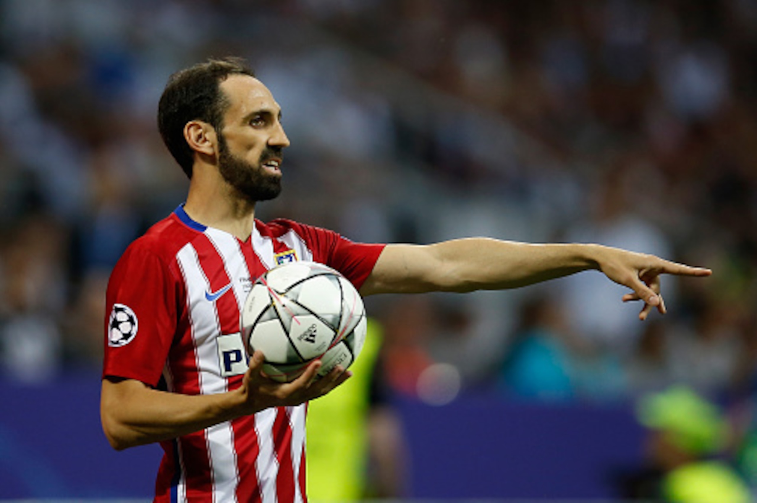 MILAN, ITALY - MAY 28:  Juanfran of Atletico Madrid takes the throw-in during the Champions League final match between Real Madrid and Club Atletico de Madrid at Stadio Giuseppe Meazza on May 28, 2016 in Milan, Italy.  (Photo by Boris Streubel/Getty Image