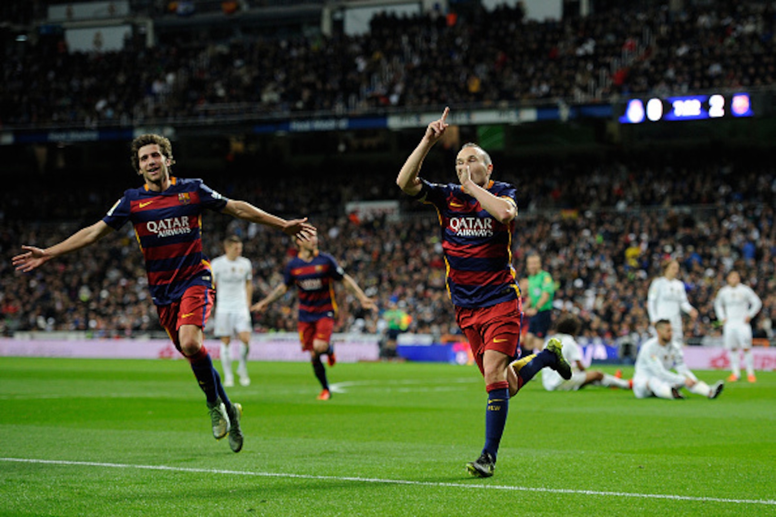 MADRID, SPAIN - NOVEMBER 21:  Andres Iniesta of FC Barcelona celebrates with Sergi Roberto after scoring his team's 3rd goal during the La Liga match between Real Madrid and Barcelona at Estadio Santiago Bernabeu on November 21, 2015 in Madrid, Spain.  (P