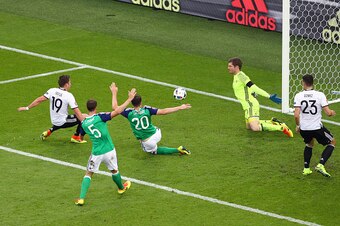 PARIS, FRANCE - JUNE 21: Mario Goetze (1st L) of Germany shoots at goal during the UEFA EURO 2016 Group C match between Northern Ireland and Germany at Parc des Princes on June 21, 2016 in Paris, France.  (Photo by Paul Gilham/Getty Images)