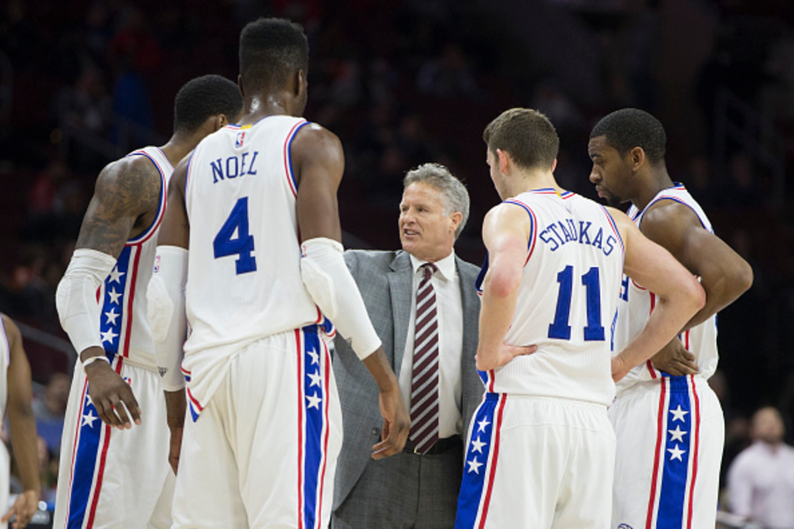 PHILADELPHIA, PA - JANUARY 26: Head coach Brett Brown of the Philadelphia 76ers talks to Robert Covington #33, Nerlens Noel #4, Nik Stauskas #11, and Hollis Thompson #31 during a timeout in the game against the Phoenix Suns on January 26, 2016 at the Well