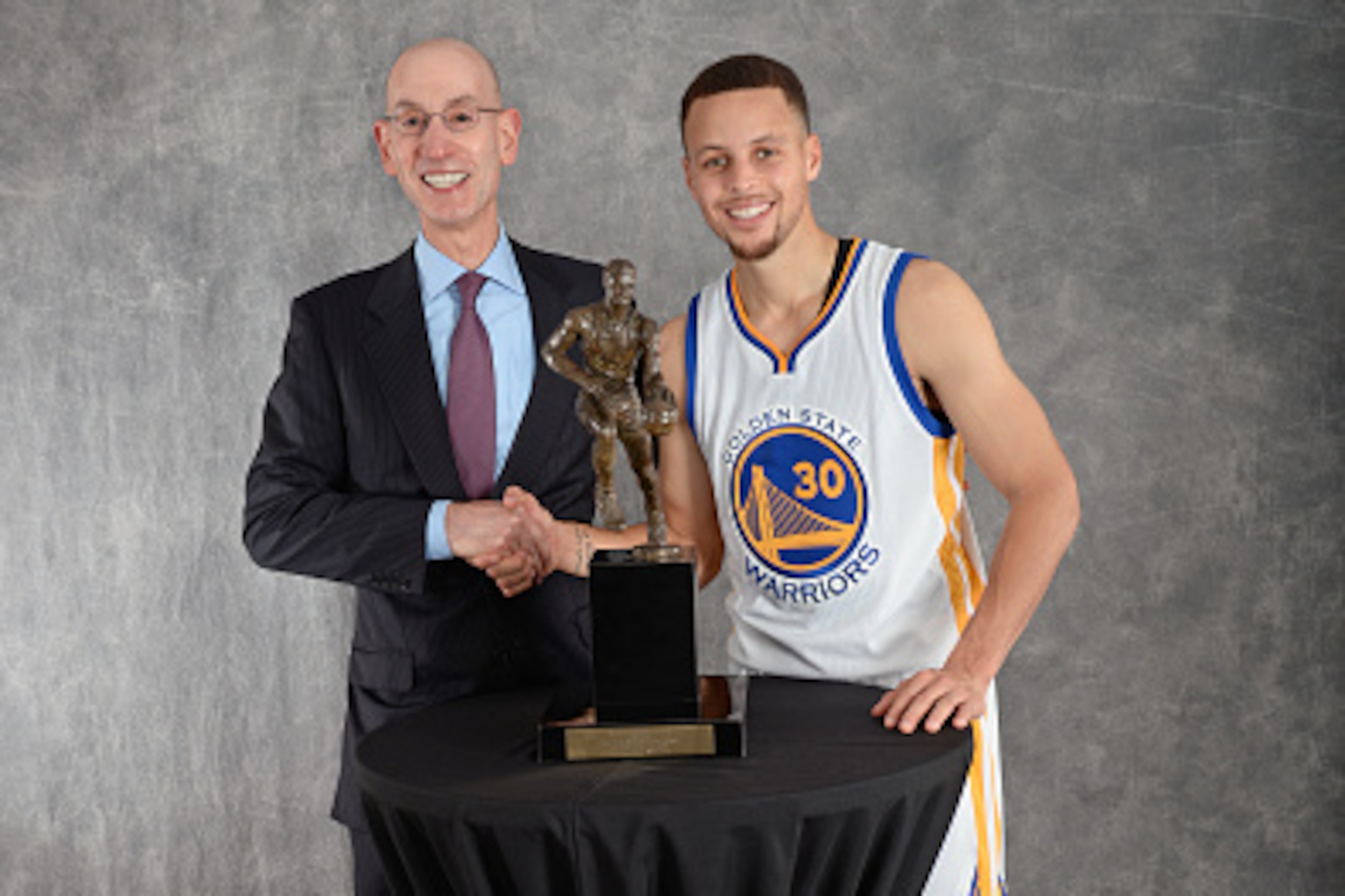 OAKLAND, CA - MAY 11: NBA Commissioner Adam Silver poses for a photo with Stephen Curry #30 of the Golden State Warriors with the Maurice Podoloff MVP trophy after the game agains the Portland Trail Blazers in Game Five of the Western Conference Semifinal
