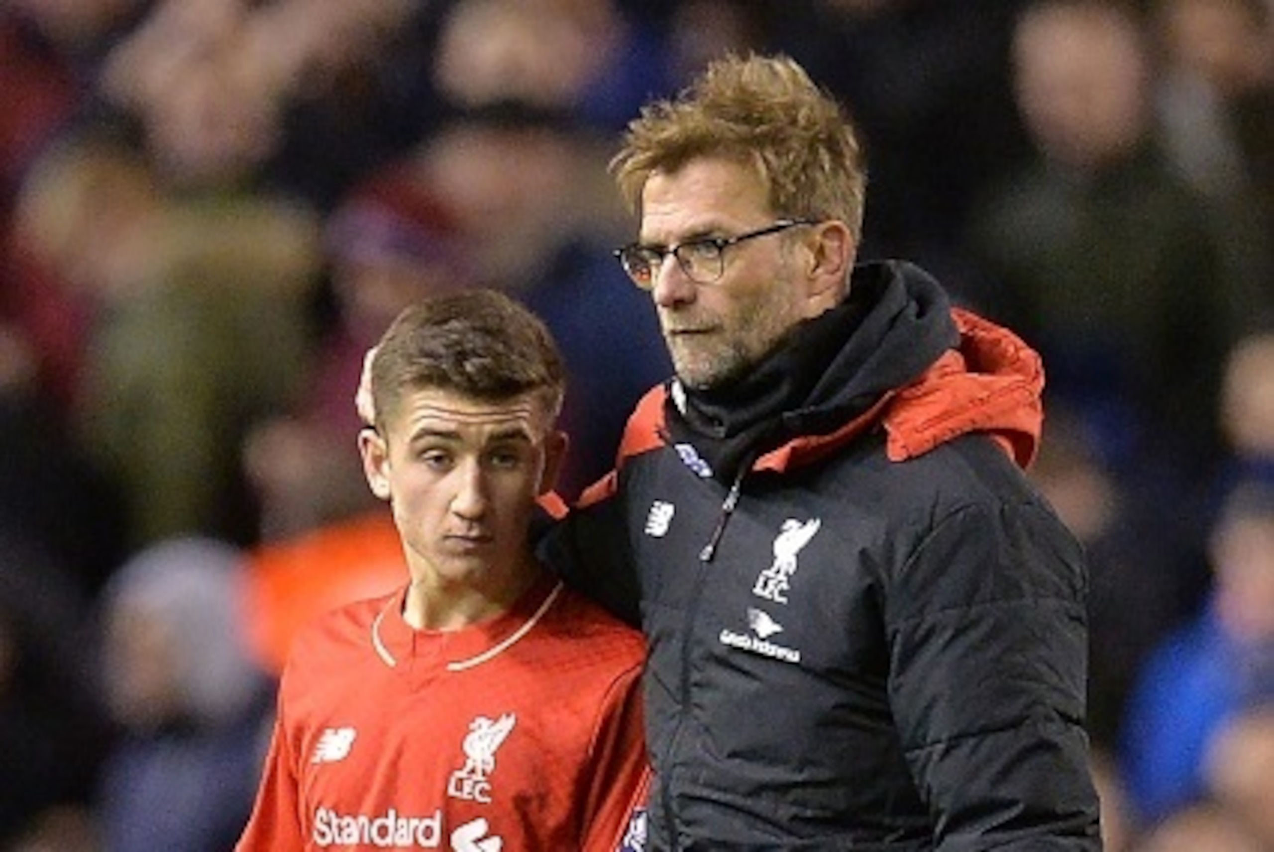 Liverpool's German manager Jurgen Klopp (R) speaks with Liverpool's English midfielder Cameron Brannagan after the end of the English FA Cup fourth round football match between Liverpool and West Ham United at Anfield in Liverpool, north west England, on 