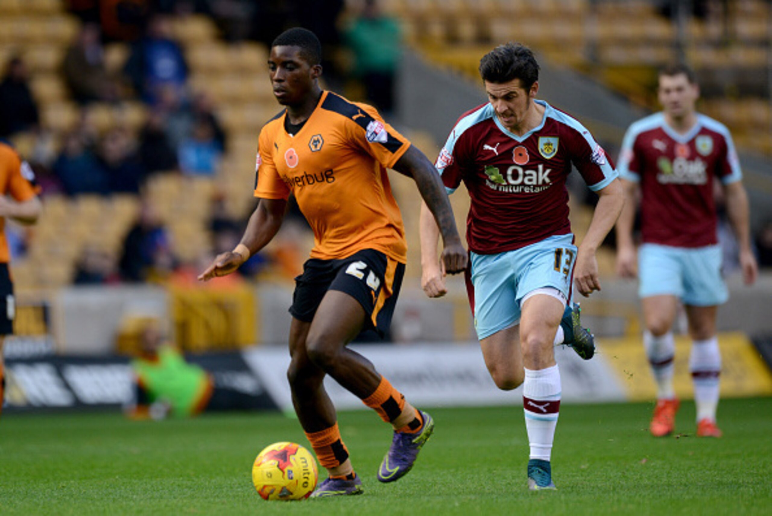 WOLVERHAMPTON, ENGLAND - NOVEMBER 07: Sheyi Ojo of Wolverhampton Wanderers and Joey Barton of Burnley during the Sky Bet Championship match between Wolverhampton Wanderers and Burnley at Molineux on November 7, 2015 in Wolverhampton, United Kingdom. (Phot