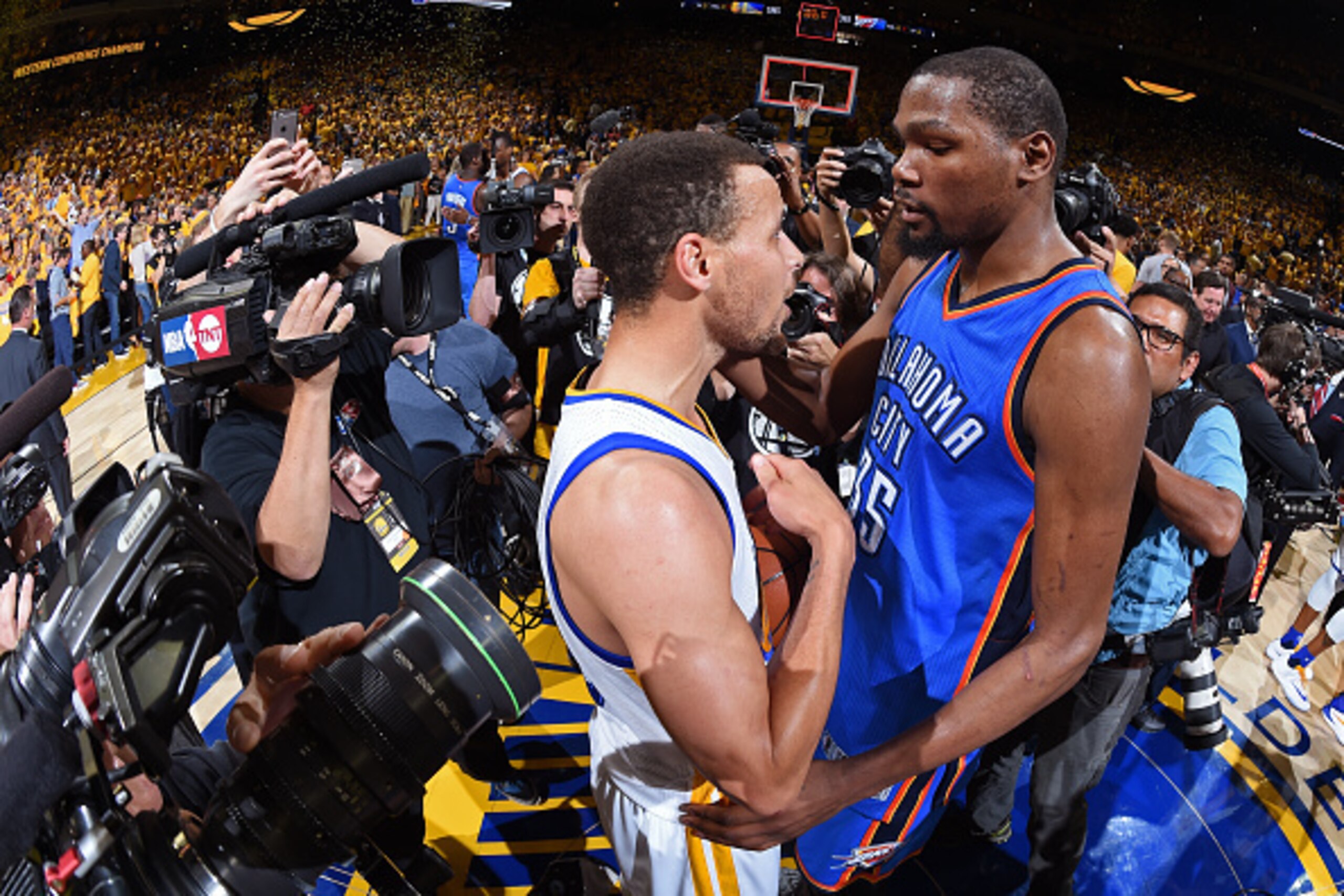 OAKLAND, CA - MAY 30:  Stephen Curry #30 of the Golden State Warriors talks to Kevin Durant #35 of the Oklahoma City Thunder after Game Seven of the Western Conference Finals during the 2016 NBA Playoffs on May 30, 2016 at ORACLE Arena in Oakland, Califor