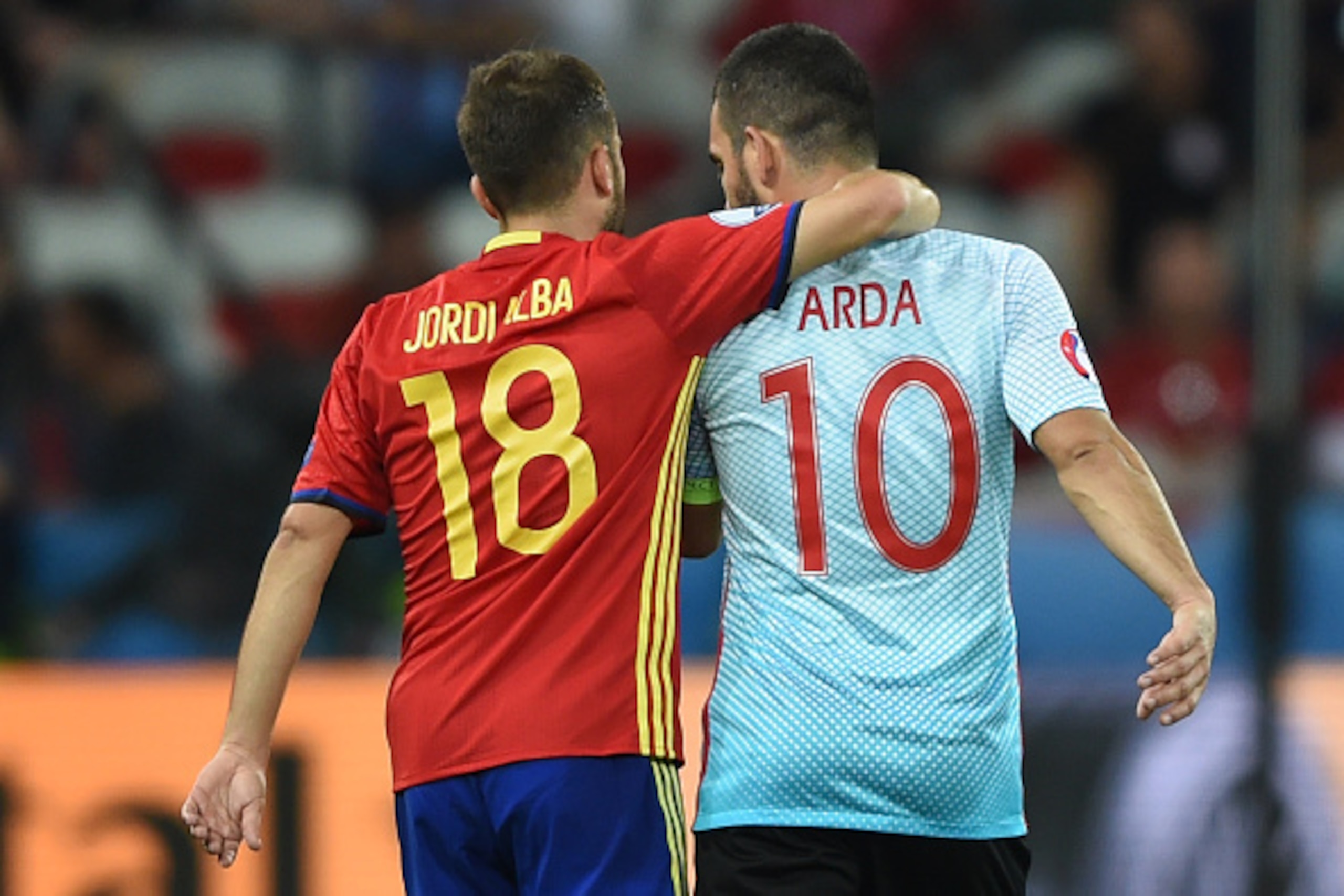 Spain's defender Jordi Alba (L) and Turkey's midfielder Arda Turan share a moment following the Euro 2016 group D football match between Spain and Turkey at the Allianz Riviera stadium in Nice on June 17, 2016. / AFP / BULENT KILIC (Photo credit s Spain's defender Jordi Alba (L) and Turkey's midfielder Arda Turan share a moment following the Euro 2016 group D football match between Spain and Turkey at the Allianz Riviera stadium in Nice on June 17, 2016. / AFP / BULENT KILIC (Photo credit s