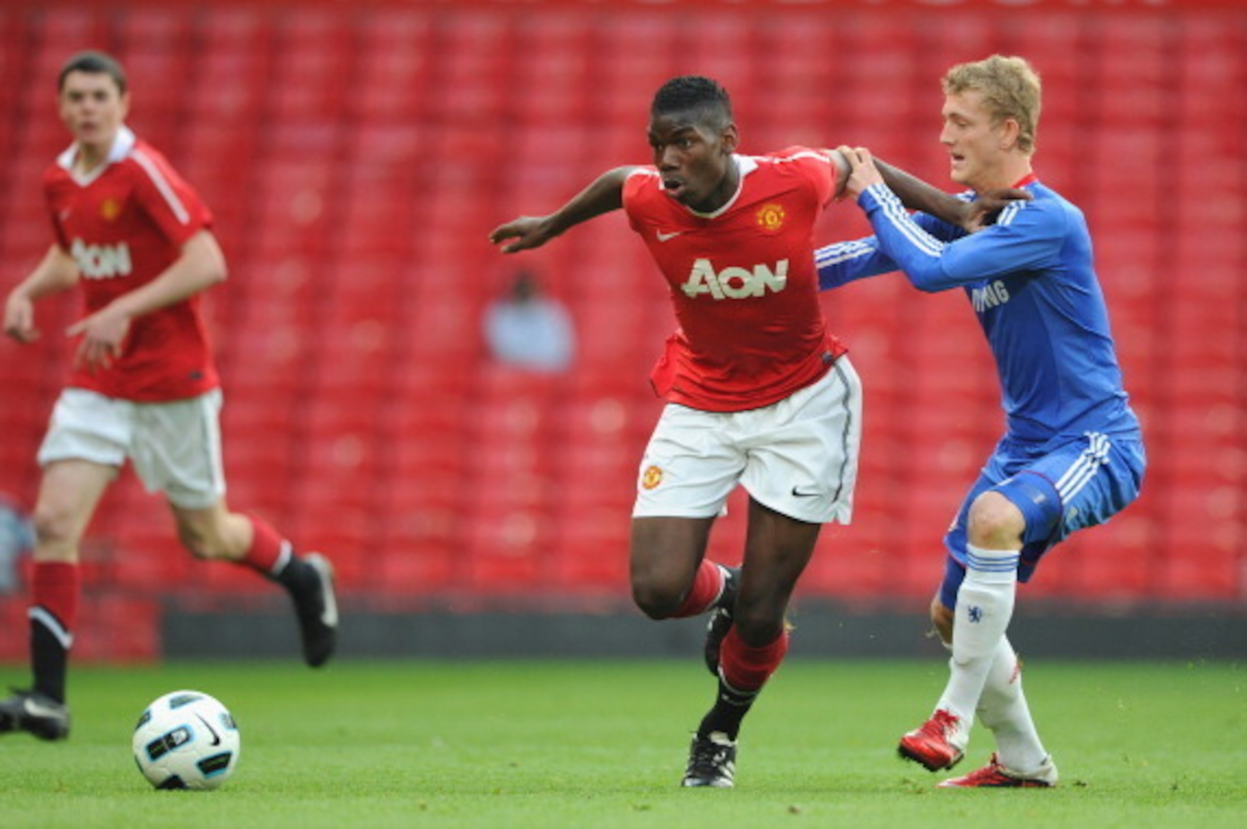 MANCHESTER, ENGLAND - APRIL 20:  Bobby Devyne of Chelsea battles Paul Pogba of Manchester United during the FA Youth Cup Semi Final 2nd Leg between Manchester United and Chelsea at Old Trafford on April 20, 2011 in Manchester, England.  (Photo by Michael 