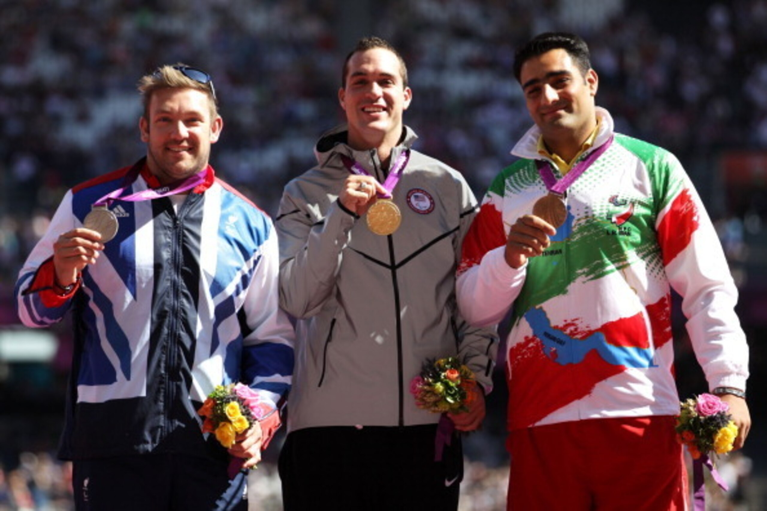LONDON, ENGLAND - SEPTEMBER 07:  (L-R) Silver medallist Dan Greaves of Great Britain and gold medallist Jeremy Campbell of the United States and bronze medallist Farzad Sepahvand of the Islamic Republic of Iran pose on the podium during the medal ceremony