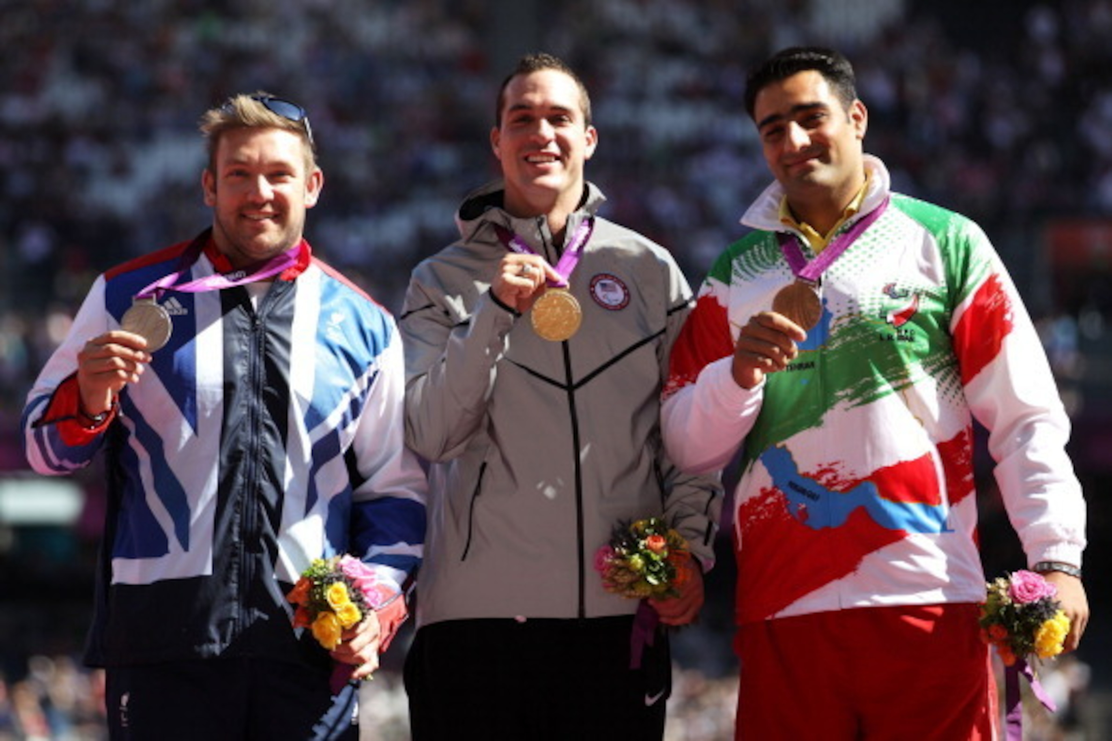 LONDON, ENGLAND - SEPTEMBER 07:  (L-R) Silver medallist Dan Greaves of Great Britain and gold medallist Jeremy Campbell of the United States and bronze medallist Farzad Sepahvand of the Islamic Republic of Iran pose on the podium during the medal ceremony