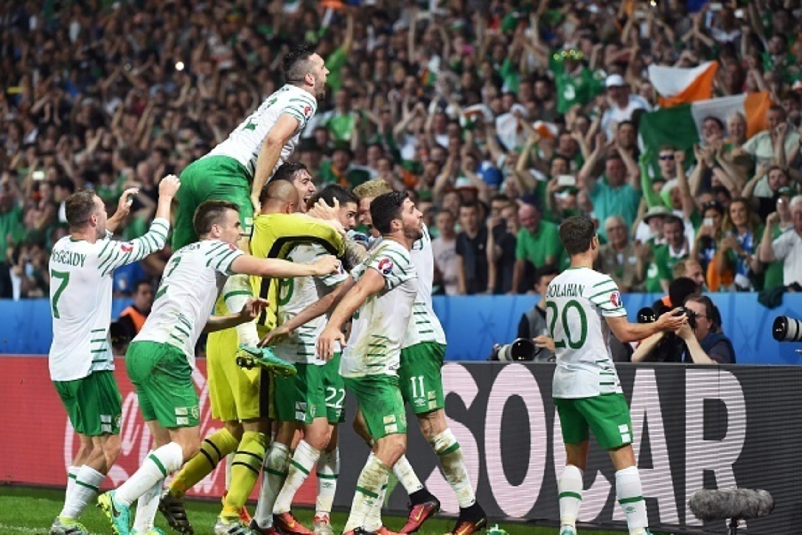 Ireland's midfielder Robert Brady celebrates scoring a goal with team mates during the Euro 2016 group E football match between Italy and Ireland at the Pierre-Mauroy stadium in Villeneuve-d'Ascq, near Lille, on June 22, 2016.
Ireland won the match 0-1. /