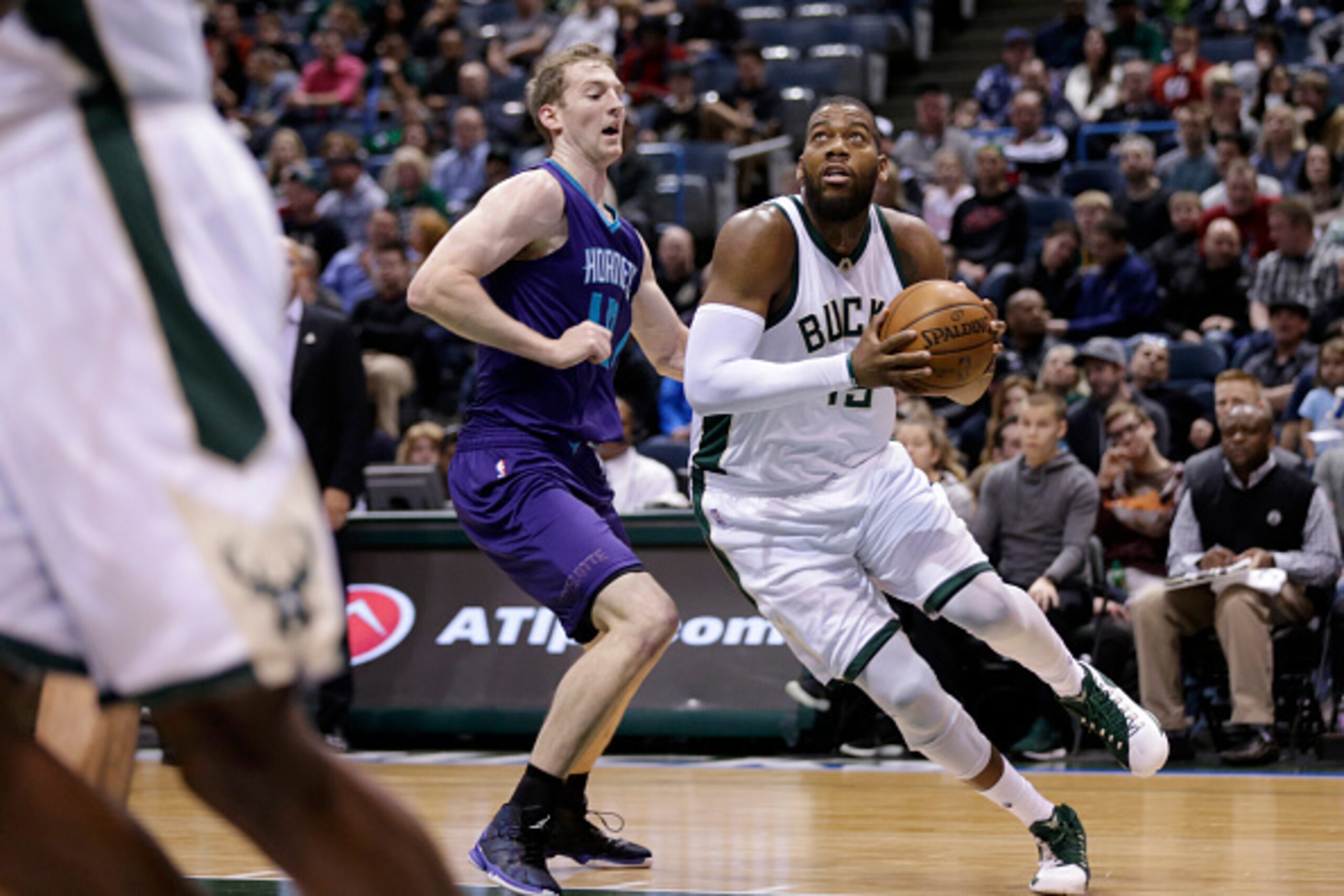 MILWAUKEE, WI - MARCH 26: Greg Monroe #15 of the Milwaukee Bucks drives to the hoop during the game against the Charlotte Hornets at BMO Harris Bradley Center on March 26, 2016 in Milwaukee, Wisconsin. NOTE TO USER: User expressly acknowledges and agrees 