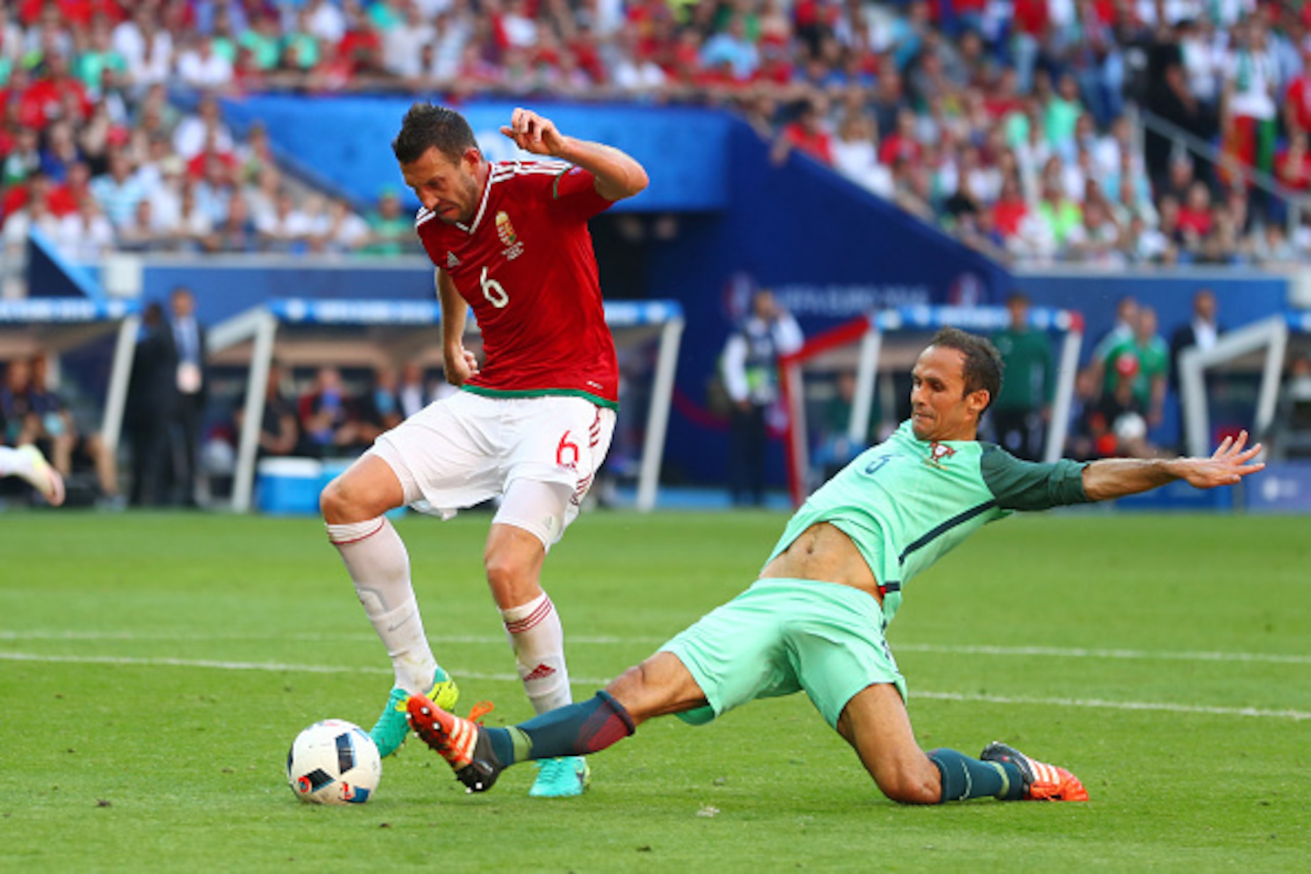 LYON, FRANCE - JUNE 22: Akos Elek of Hungary is tackled by Ricardo Carvalho of Portugal during the UEFA EURO 2016 Group F match between Hungary and Portugal at Stade des Lumieres on June 22, 2016 in Lyon, France. (Photo by Julian Finney/Getty Images) LYON, FRANCE - JUNE 22: Akos Elek of Hungary is tackled by Ricardo Carvalho of Portugal during the UEFA EURO 2016 Group F match between Hungary and Portugal at Stade des Lumieres on June 22, 2016 in Lyon, France. (Photo by Julian Finney/Getty Images)