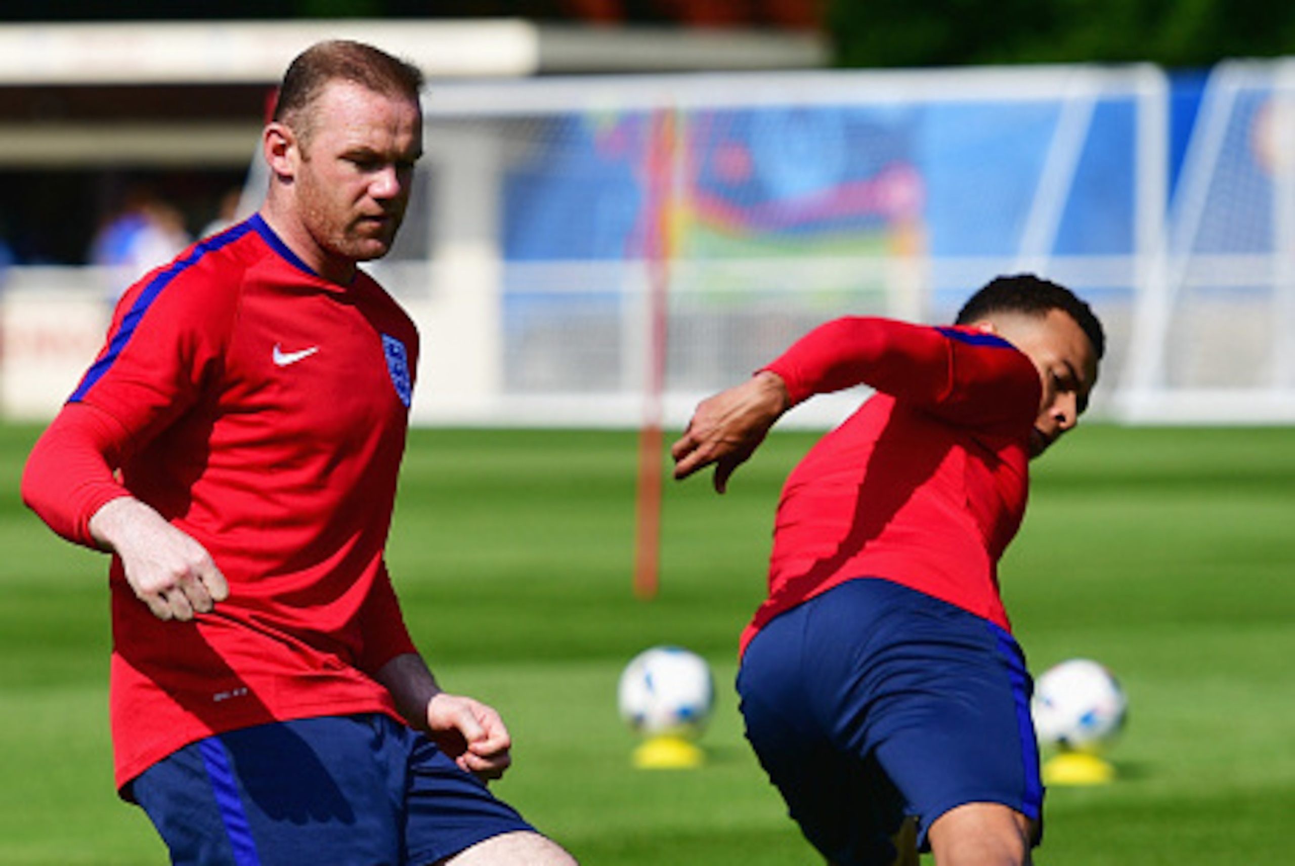 CHANTILLY, FRANCE - JUNE 07:  Wayne Rooney and Dele Alli perform passing drills during an England training session ahead of the UEFA EURO 2016 at Stade du Bourgognes on June 7, 2016 in Chantilly, France. England's opening match at the European Championshi