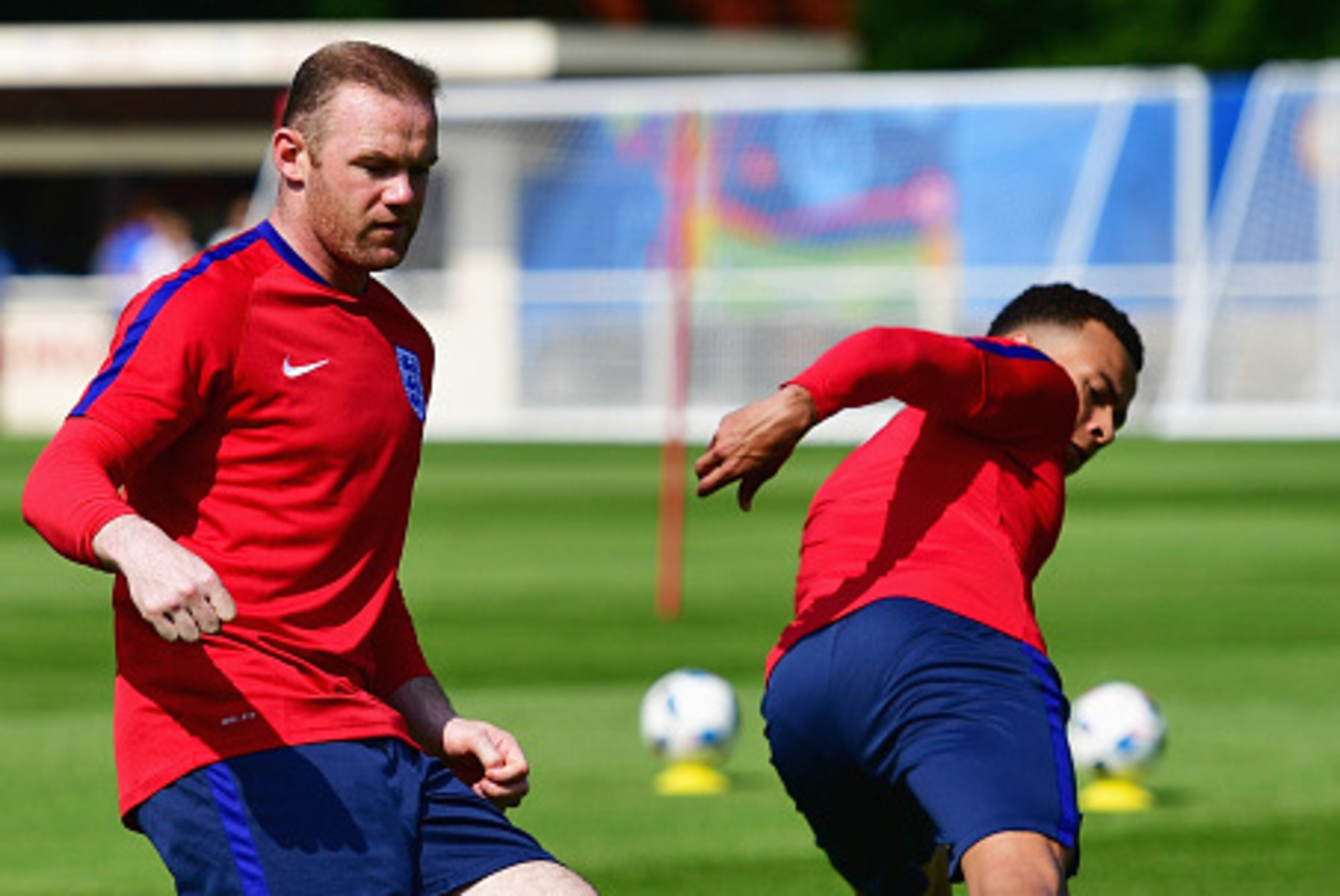 CHANTILLY, FRANCE - JUNE 07:  Wayne Rooney and Dele Alli perform passing drills during an England training session ahead of the UEFA EURO 2016 at Stade du Bourgognes on June 7, 2016 in Chantilly, France. England's opening match at the European Championshi
