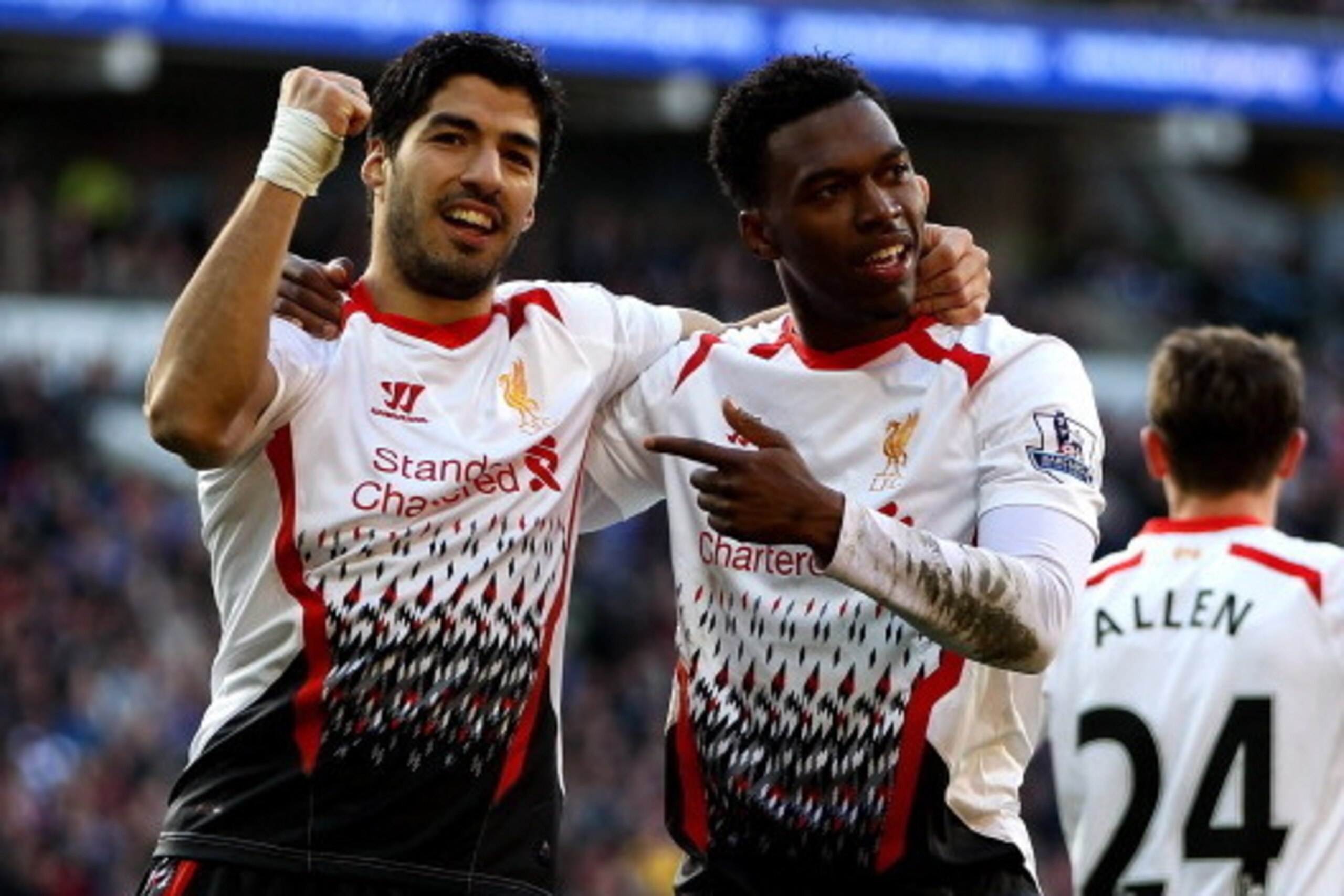 CARDIFF, WALES - MARCH 22:  Daniel Sturridge of Liverpool celebrates with team mate Luis Suarez after scoring his team's fifth goal during the Barclays Premier League match between Cardiff City and Liverpool at Cardiff City Stadium on March 22, 2014 in Ca