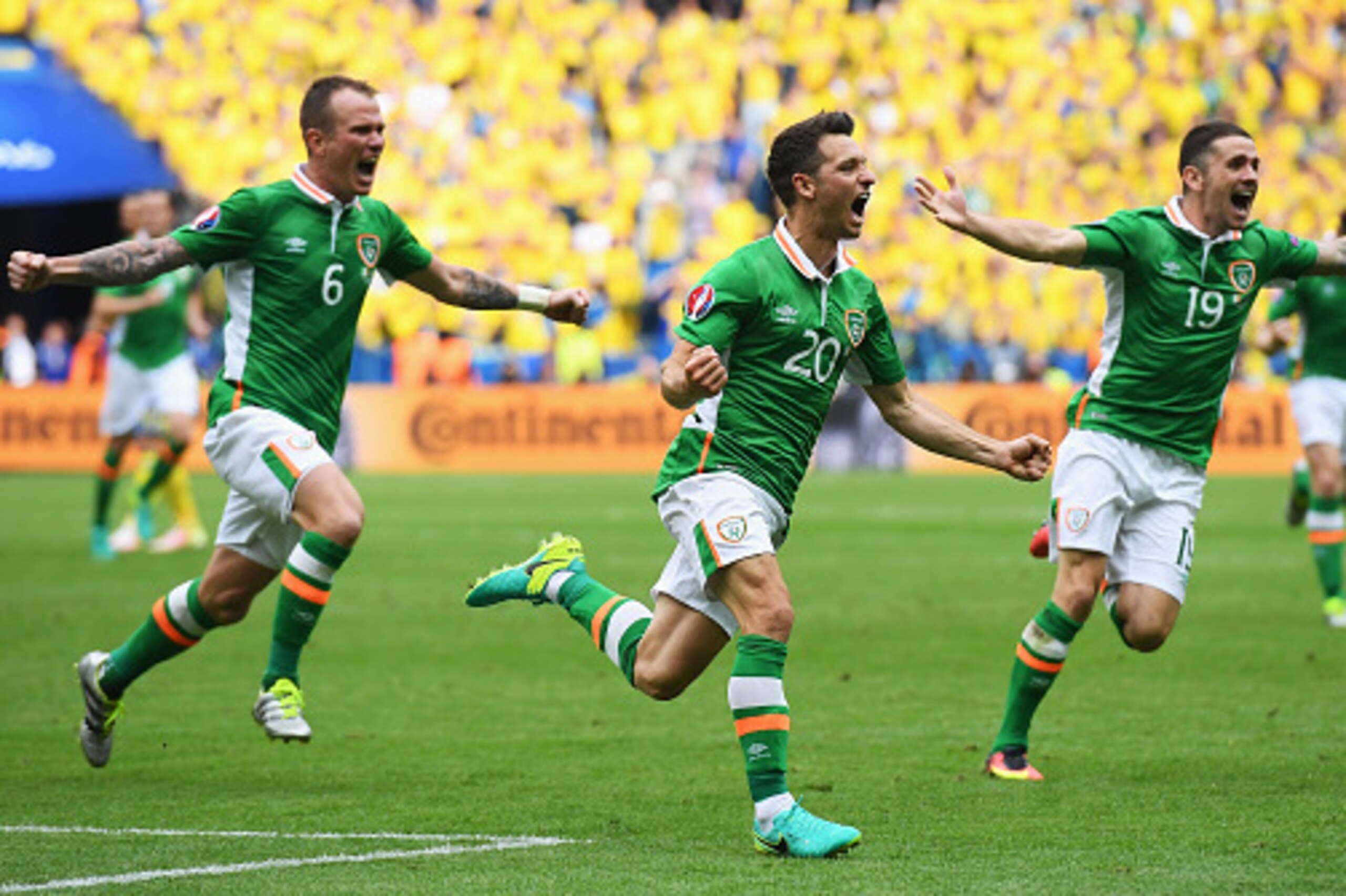 PARIS, FRANCE - JUNE 13: Wes Hoolahan (C) of Republic of Ireland celebrates scoring his team's first goal with his team mate Glenn Whelan (L) and Robbie Brady (R) during the UEFA EURO 2016 Group E match between Republic of Ireland and Sweden at Stade de PARIS, FRANCE - JUNE 13: Wes Hoolahan (C) of Republic of Ireland celebrates scoring his team's first goal with his team mate Glenn Whelan (L) and Robbie Brady (R) during the UEFA EURO 2016 Group E match between Republic of Ireland and Sweden at Stade de