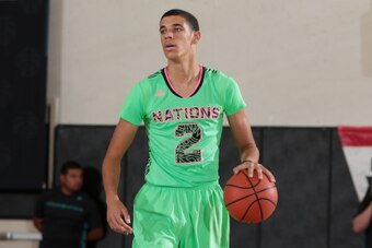 LONG BEACH, CA - AUGUST 4: Lonzo Ball #2 brings the ball up the court during the 2014 adidas Nations championship game between 2016 adidas U.S. Lillard and 2016 U.S. Wall on August 4, 2014 at Long Beach City College in Long Beach, California. (Photo by Ke