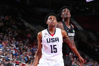 PORTLAND, OR - APRIL 9:  Marques Bolden #15 of the USA Junior Select Team boxes out DeAndre Ayton #13 of the World Select Team during the game on April 9, 2016 at the MODA Center Arena in Portland, Oregon. NOTE TO USER: User expressly acknowledges and agr