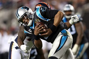 SANTA CLARA, CA - FEBRUARY 07:  Cam Newton #1 of the Carolina Panthers is hit in the fourth quarter against the Denver Broncos during Super Bowl 50 at Levi's Stadium on February 7, 2016 in Santa Clara, California.  (Photo by Patrick Smith/Getty Images)