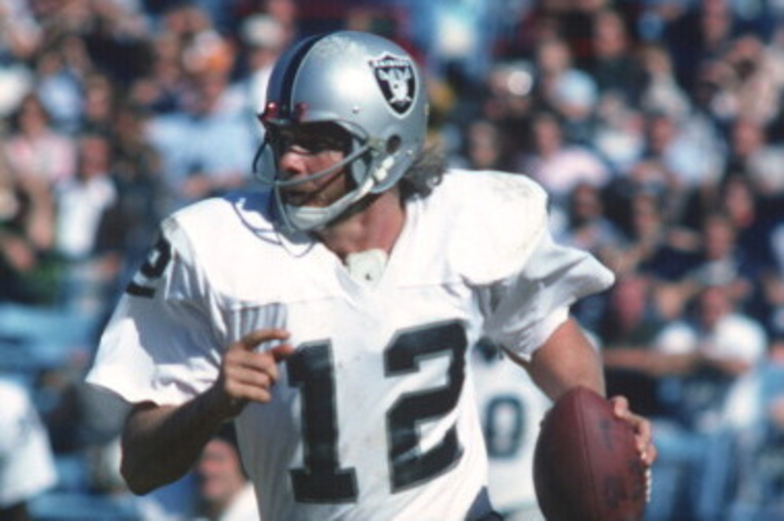 BALTIMORE, MD - SEPTEMBER 28: Quarterback Ken Stabler #12 of the Oakland Raiders rolls out to pass against the Baltimore, Colts during an NFL football game September 28, 1975 at Memorial Stadium in Baltimore, Maryland. Stabler played for the Raiders from 