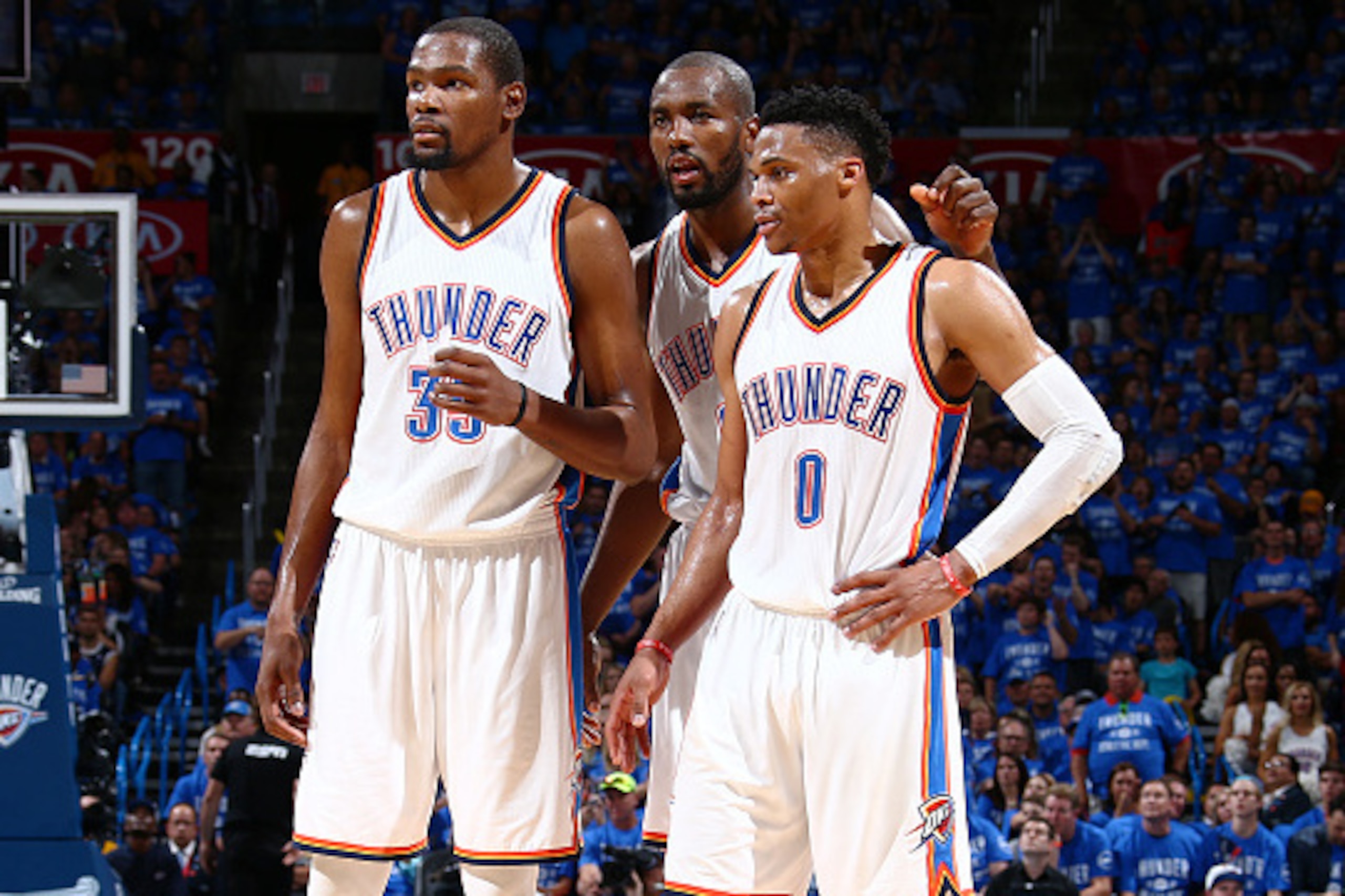 OKLAHOMA CITY, OK- MAY 12:  Kevin Durant #35, Serge Ibaka #9 and Russell Westbrook #0 of the Oklahoma City Thunder talk during the game against the San Antonio Spurs in Game Six of the Western Conference Semifinals during the 2016 NBA Playoffs on May 12, 